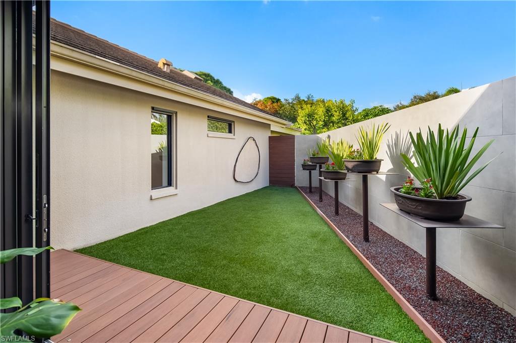 705 Shadow Lake Lane Naples, FL 34108 - Photo 41 of 47 a view of a porch with wooden floor