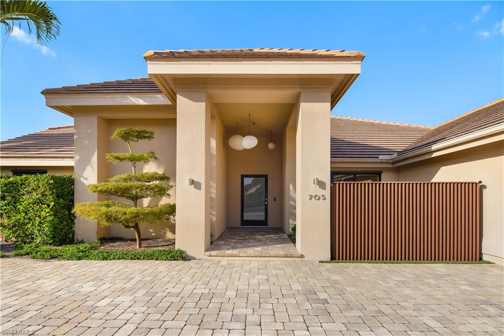 705 Shadow Lake Lane Naples, FL 34108 - Photo 46 of 47 a view of a entryway door front of house