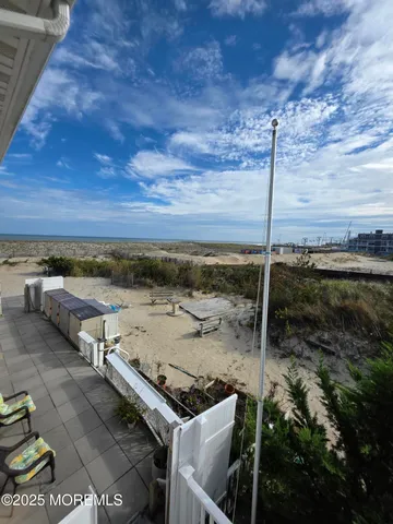 a view of a terrace with wooden floor and city view