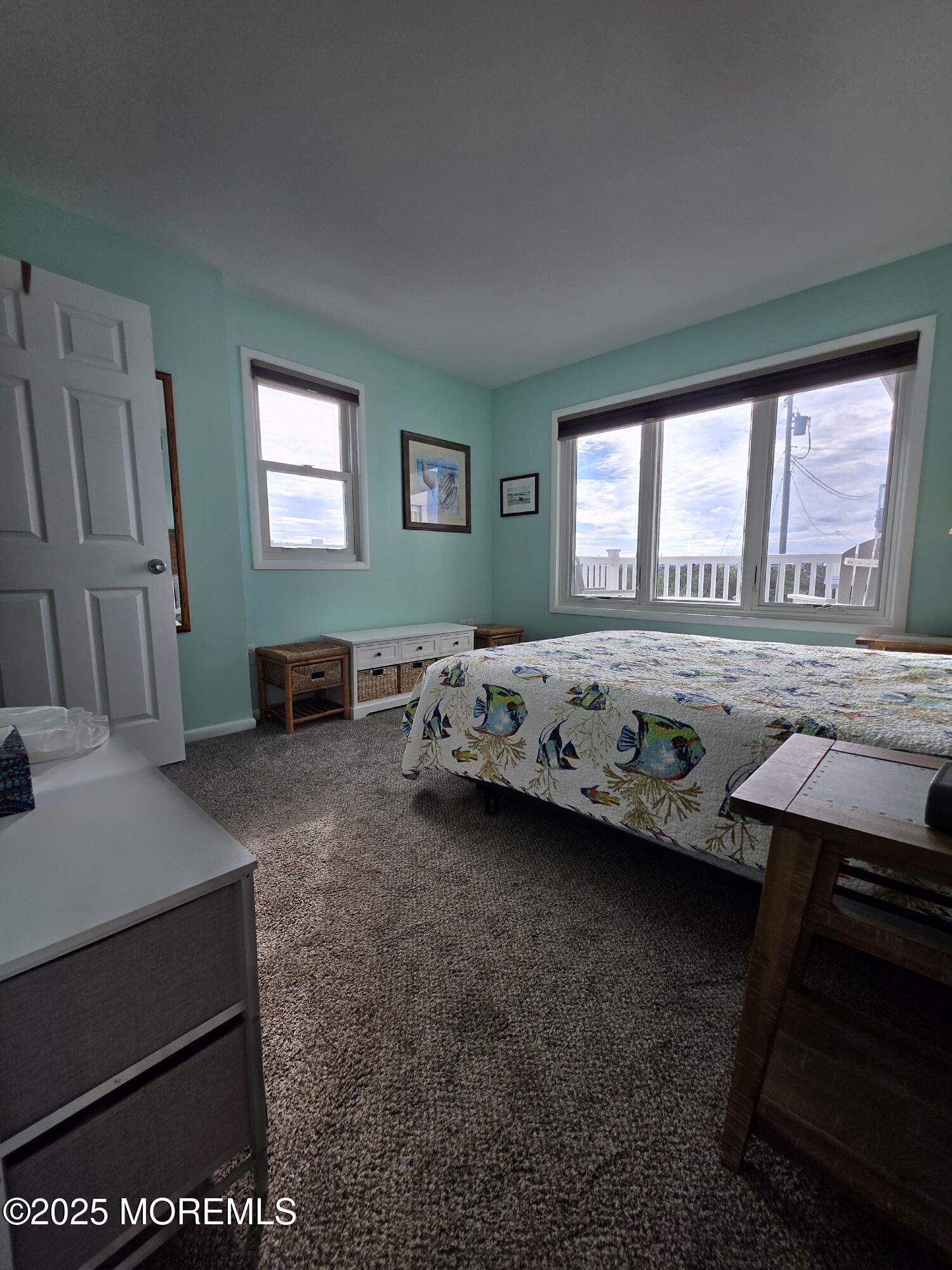 42 Dune Terrace Seaside Heights, NJ 08751 - Photo 12 of 17 a bedroom with a bed and a window