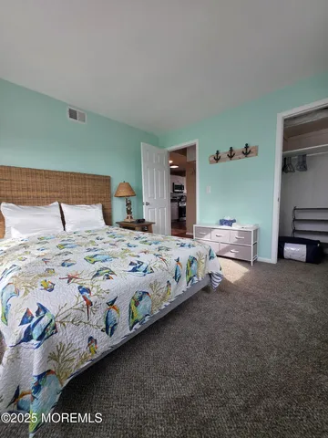 a bedroom with bed and a night stand