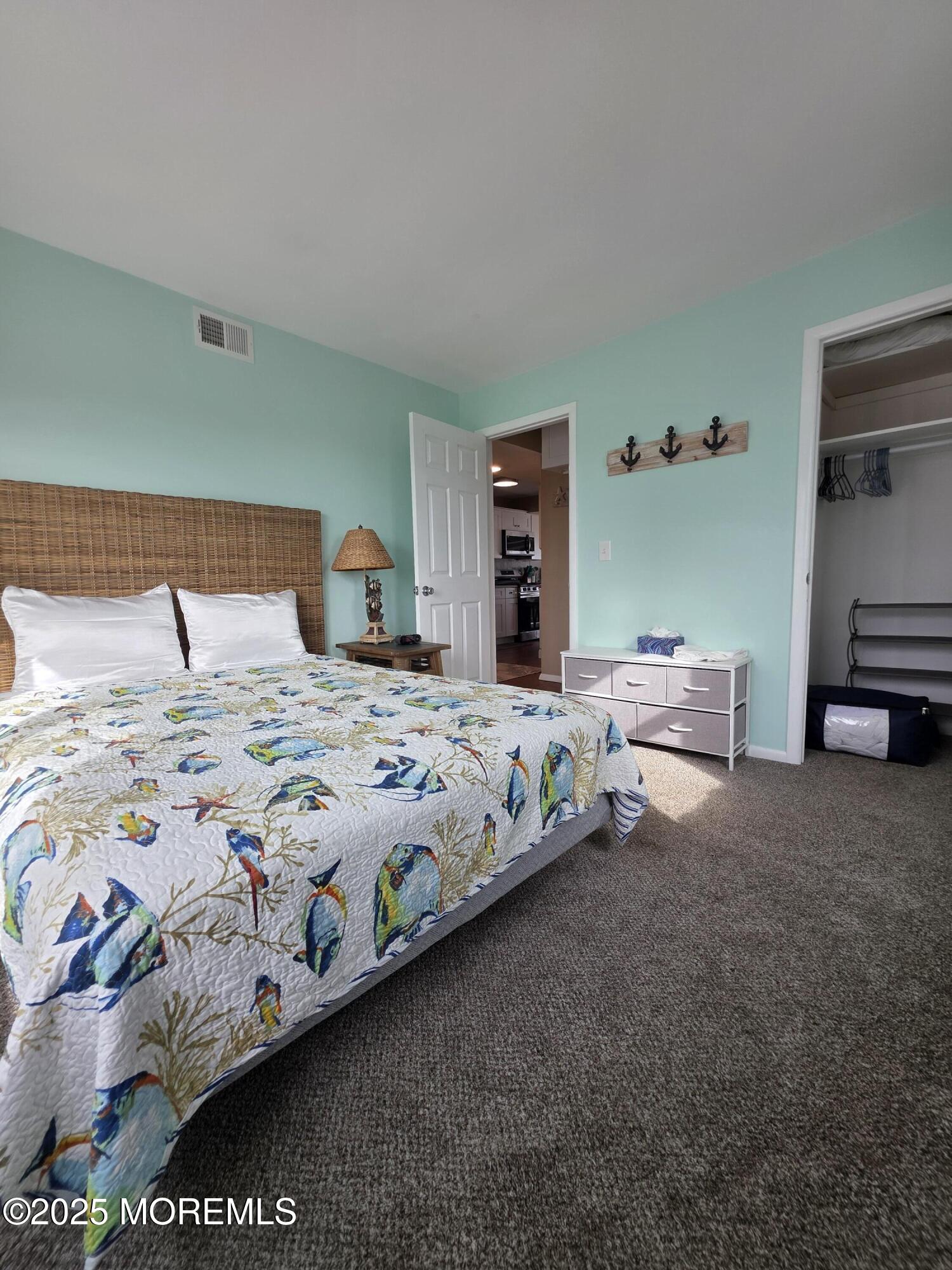 42 Dune Terrace Seaside Heights, NJ 08751 - Photo 13 of 17 a bedroom with bed and a night stand