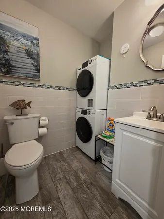 a bathroom with a toilet and a mirror