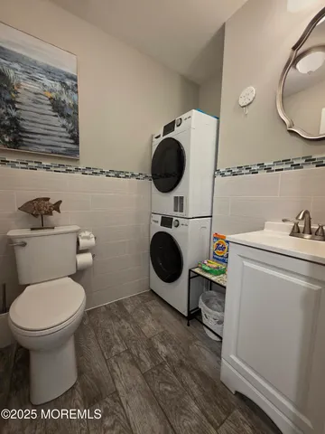 a bathroom with a toilet and a mirror