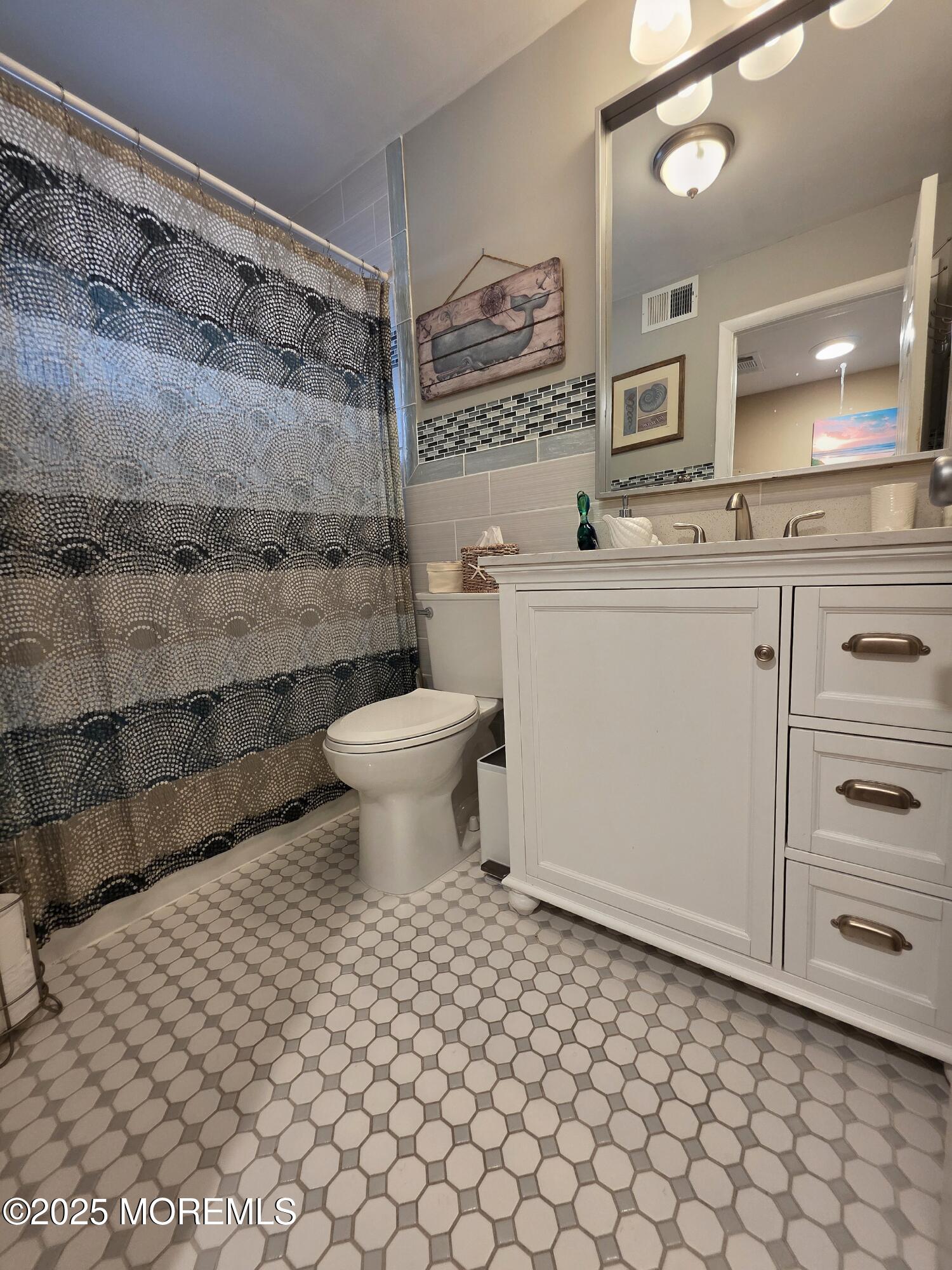 42 Dune Terrace Seaside Heights, NJ 08751 - Photo 17 of 17 a bathroom with a toilet sink and mirror