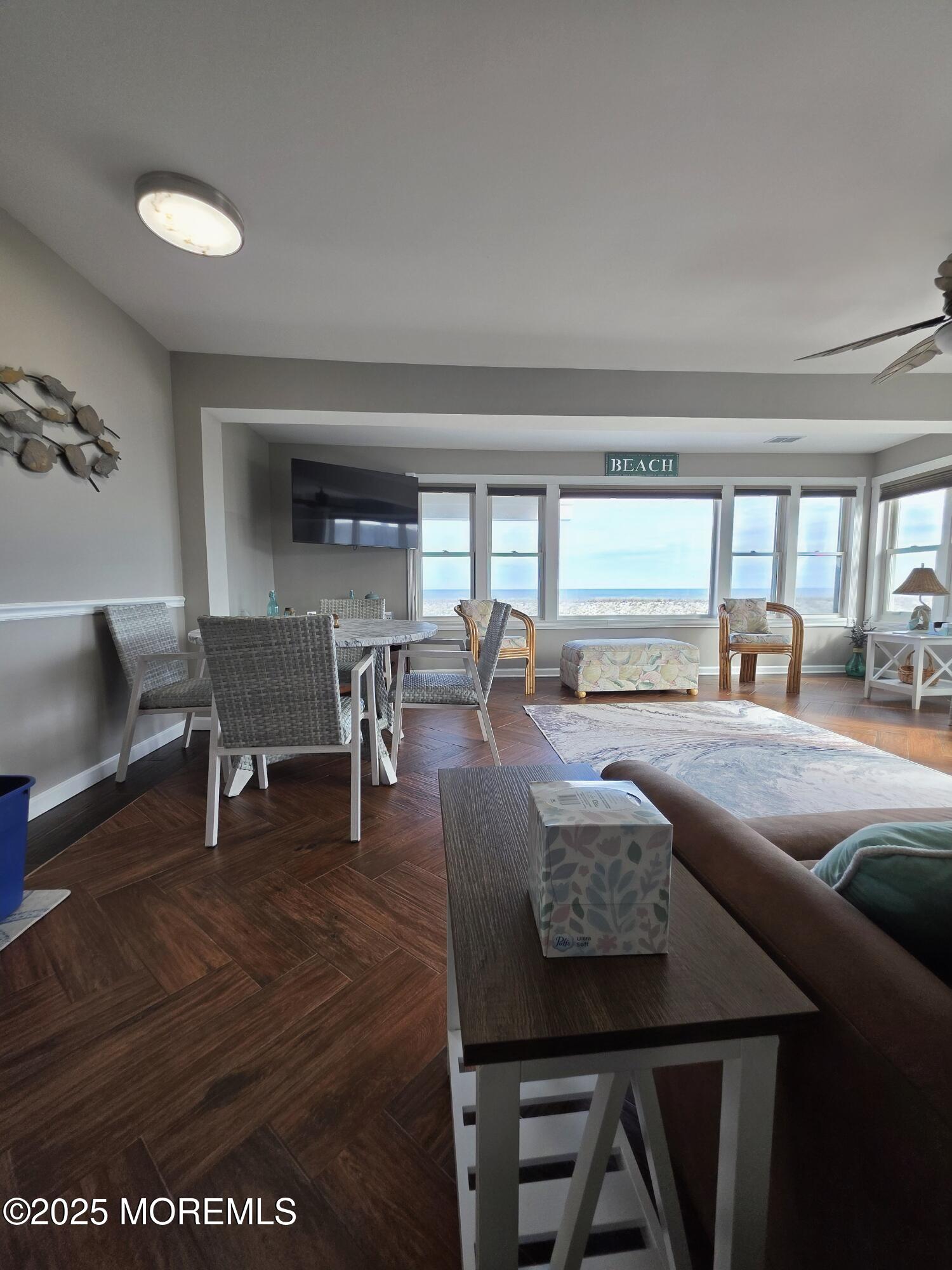 42 Dune Terrace Seaside Heights, NJ 08751 - Photo 2 of 17 a living room with furniture and a large window
