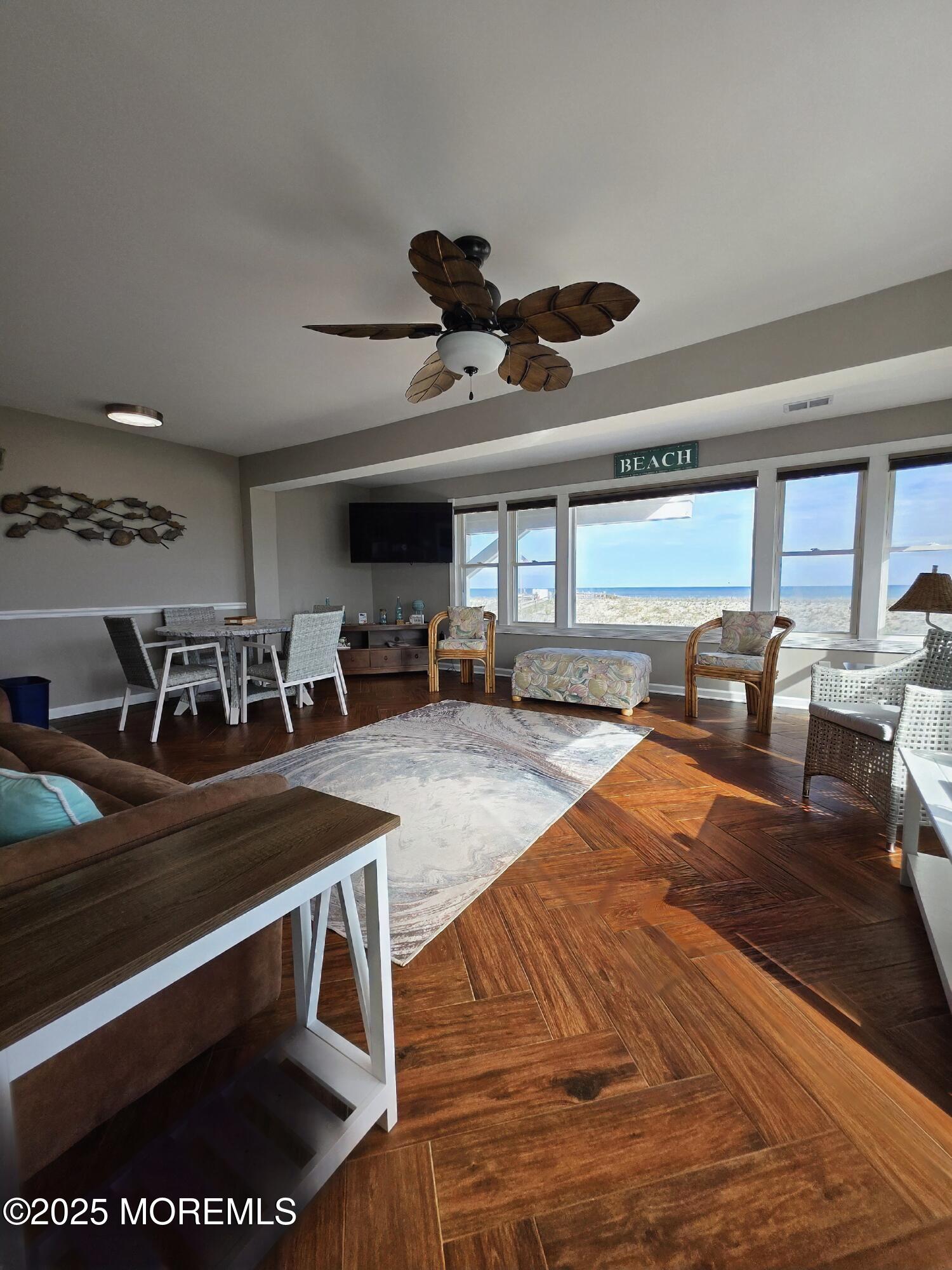 42 Dune Terrace Seaside Heights, NJ 08751 - Photo 3 of 17 a room with gym equipment and a large window