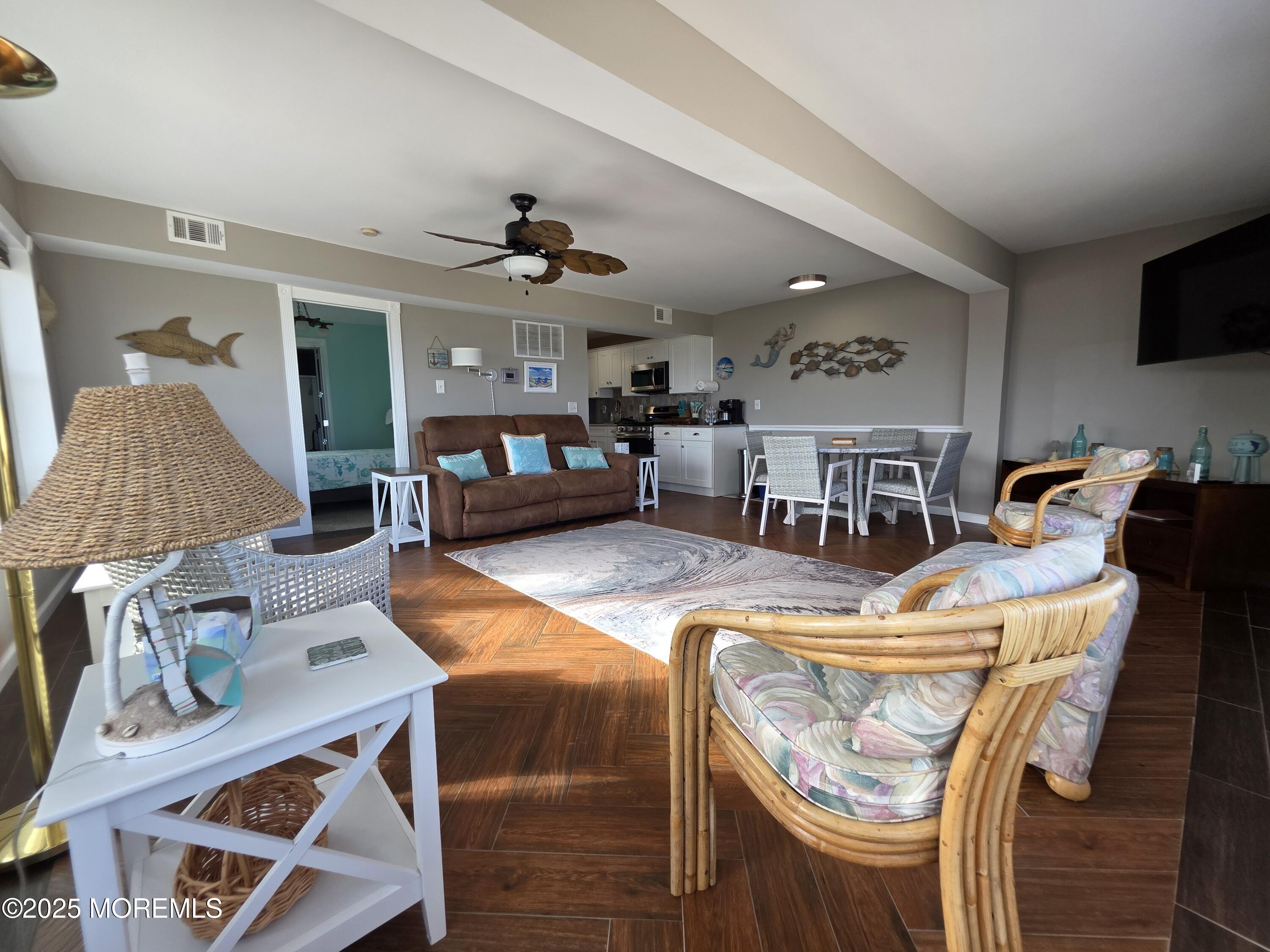 42 Dune Terrace Seaside Heights, NJ 08751 - Photo 5 of 17 a living room with furniture and flat screen tv