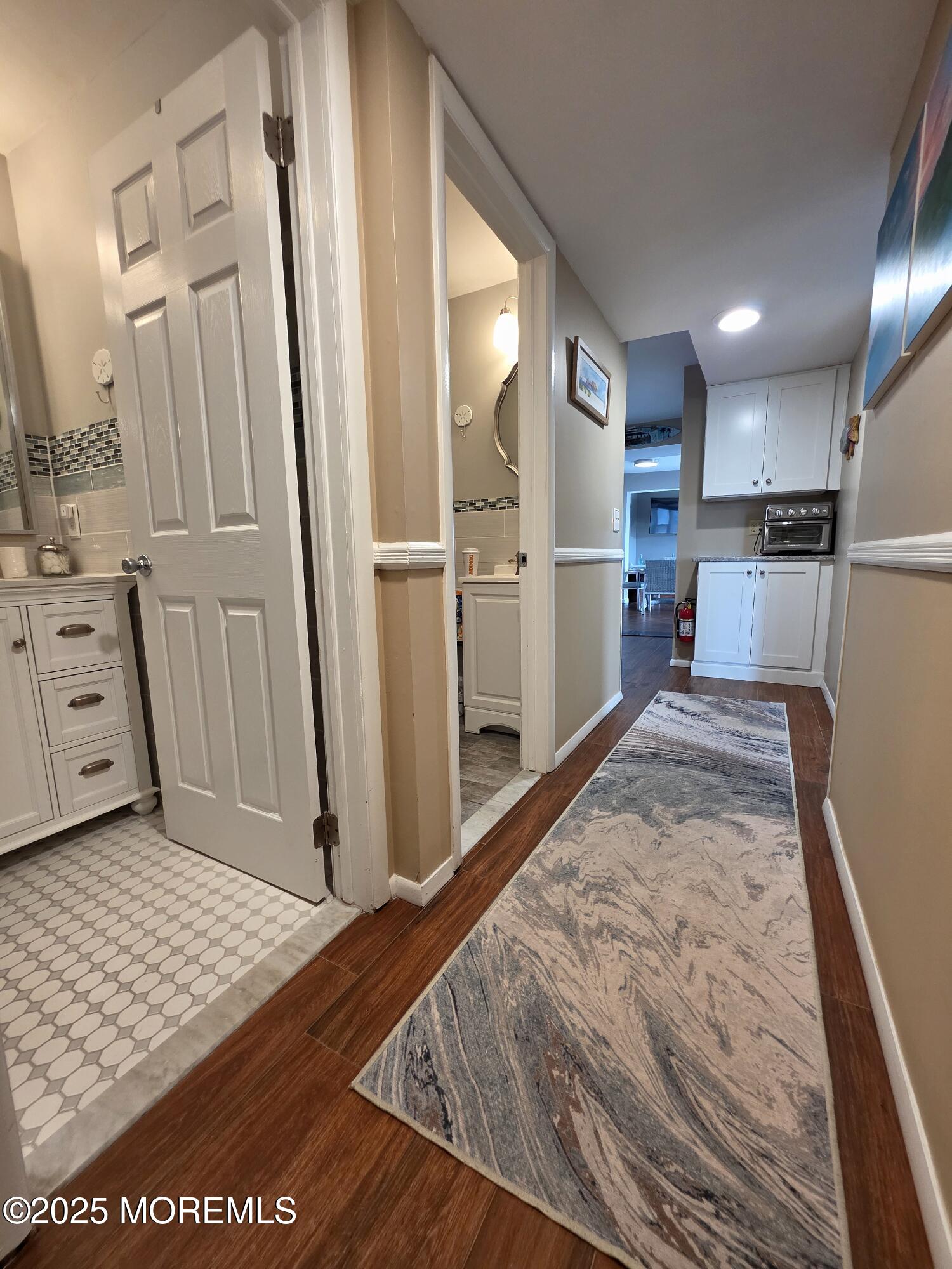 42 Dune Terrace Seaside Heights, NJ 08751 - Photo 8 of 17 a view of kitchen with refrigerator microwave and cabinets