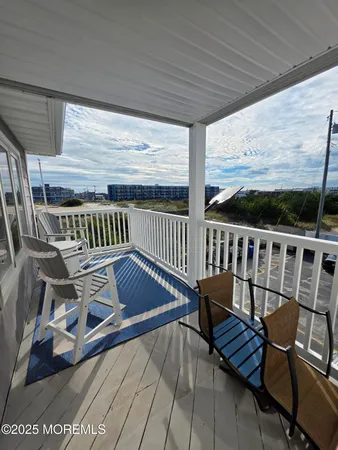 a view of a balcony with furniture