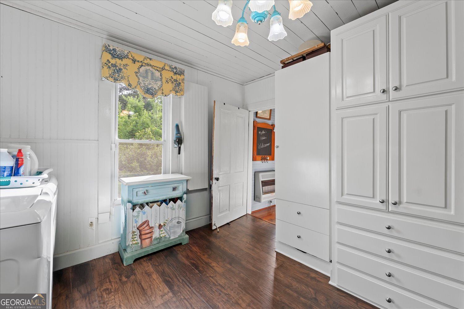 6644 East Cadley Road Norwood, GA 30821 - Photo 28 of 53 a view of an empty room with a window and wooden floor