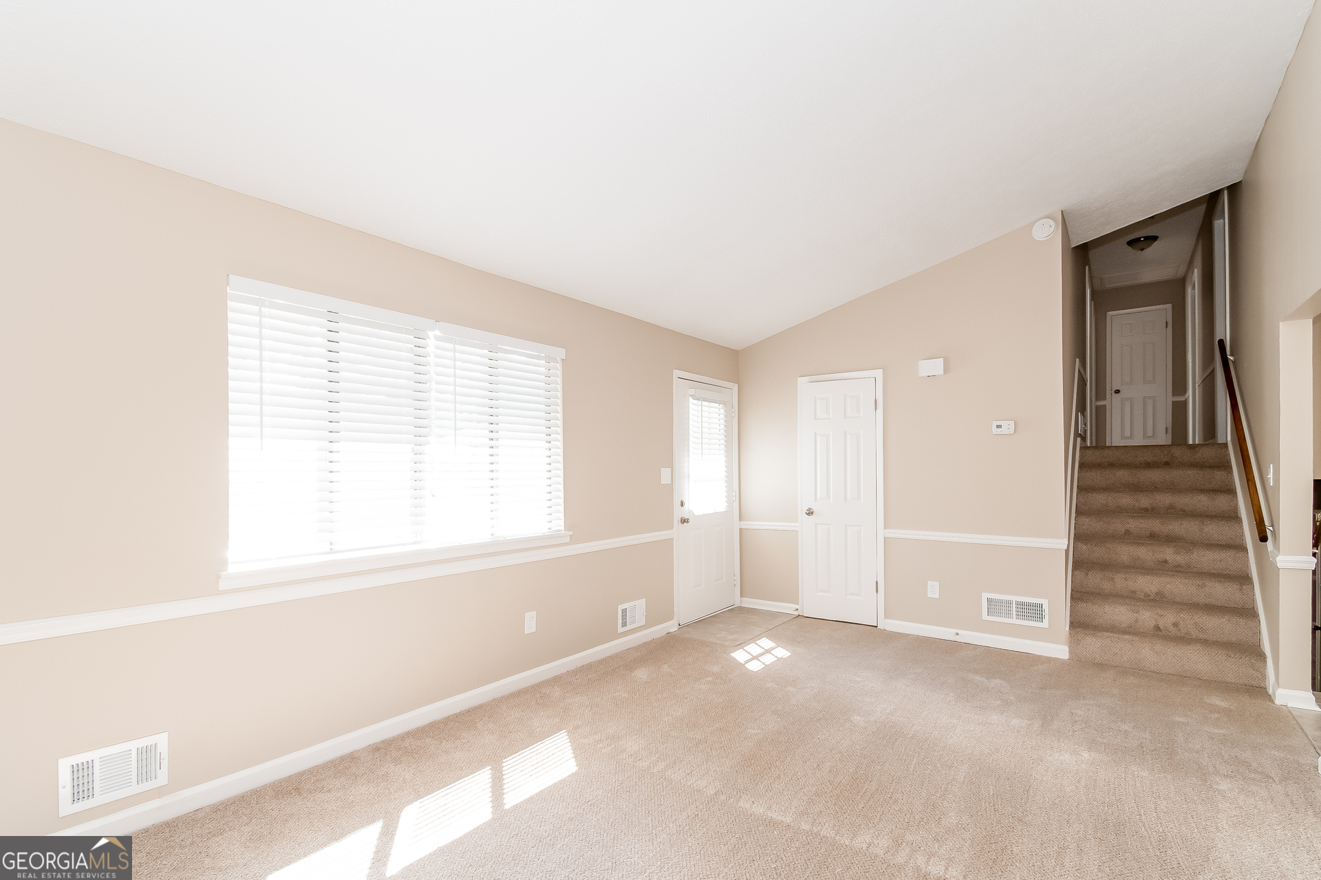 2264 Rocklane Drive Conley, GA 30288 - Photo 2 of 15 a view of an empty room with a window