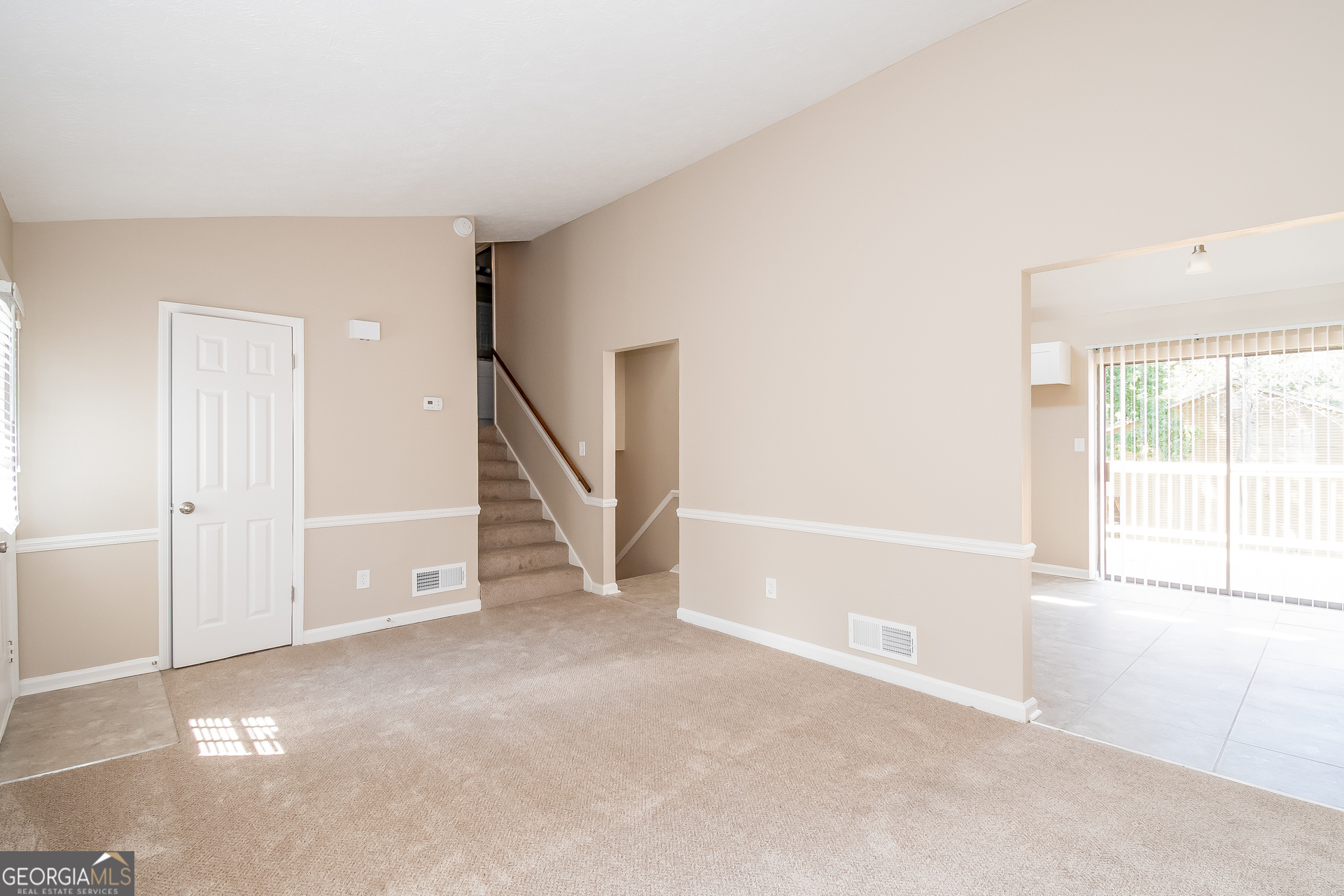 2264 Rocklane Drive Conley, GA 30288 - Photo 4 of 15 a view of an empty room with a window