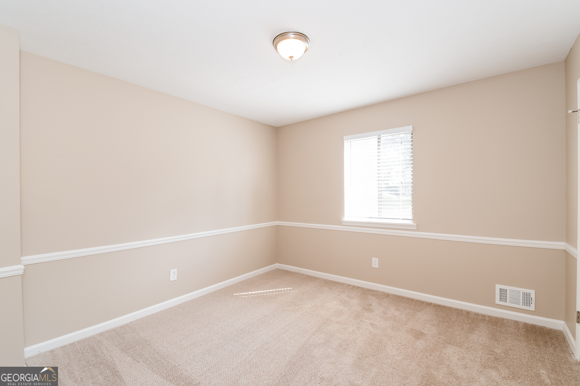 2264 Rocklane Drive Conley, GA 30288 - Photo 10 of 15 an empty room with a window