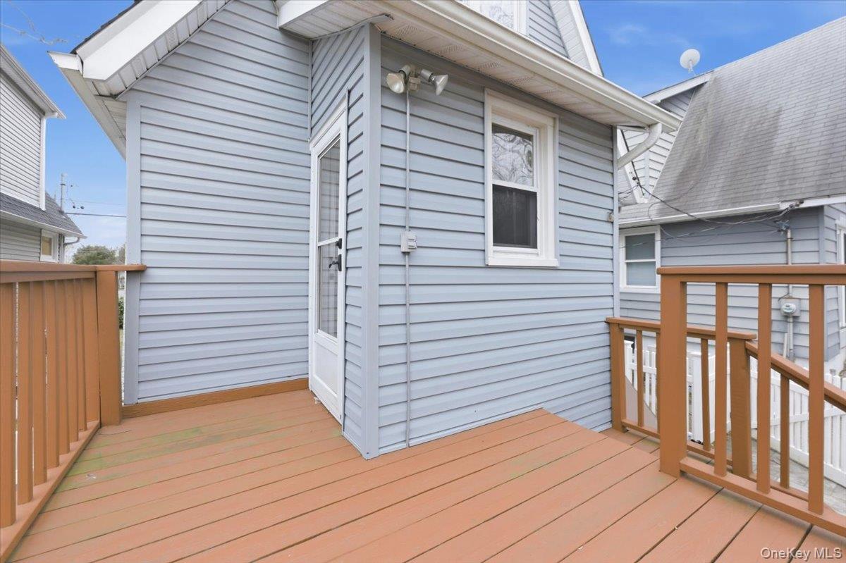 22 Sunset Trail, Unit 22 Bronx, NY 10465 - Photo 16 of 21 a view of a house with wooden deck