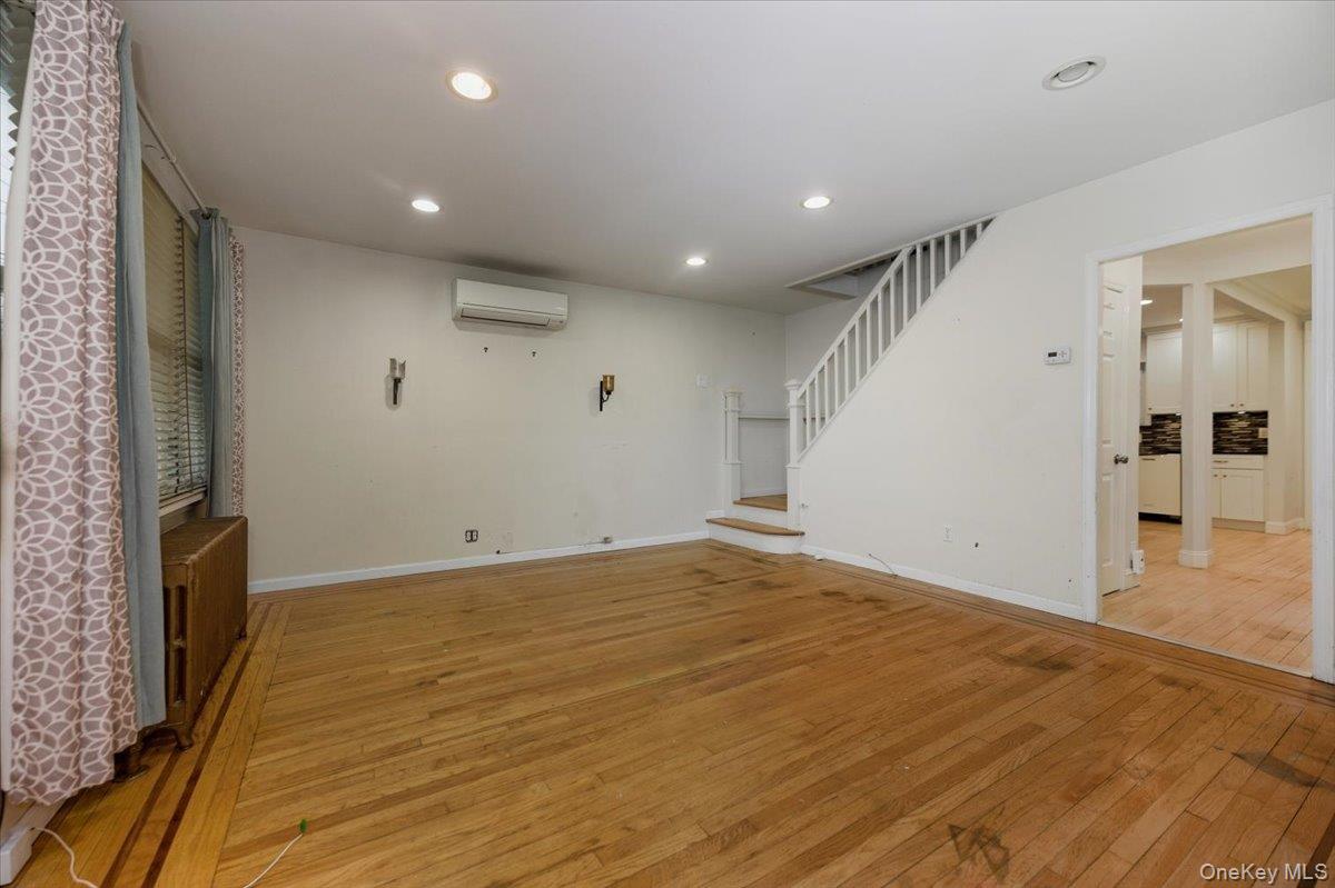 22 Sunset Trail, Unit 22 Bronx, NY 10465 - Photo 3 of 21 a view of empty room with wooden floor