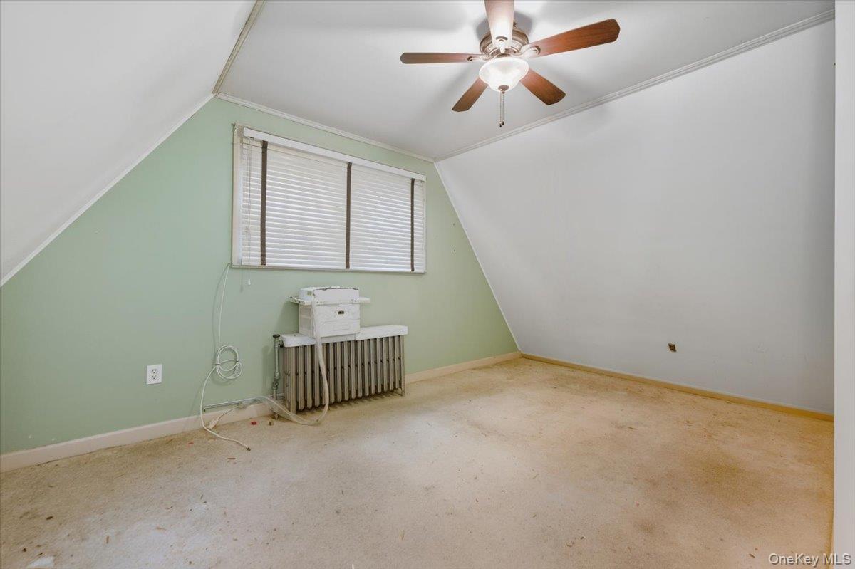 22 Sunset Trail, Unit 22 Bronx, NY 10465 - Photo 9 of 21 an empty room with windows and fan