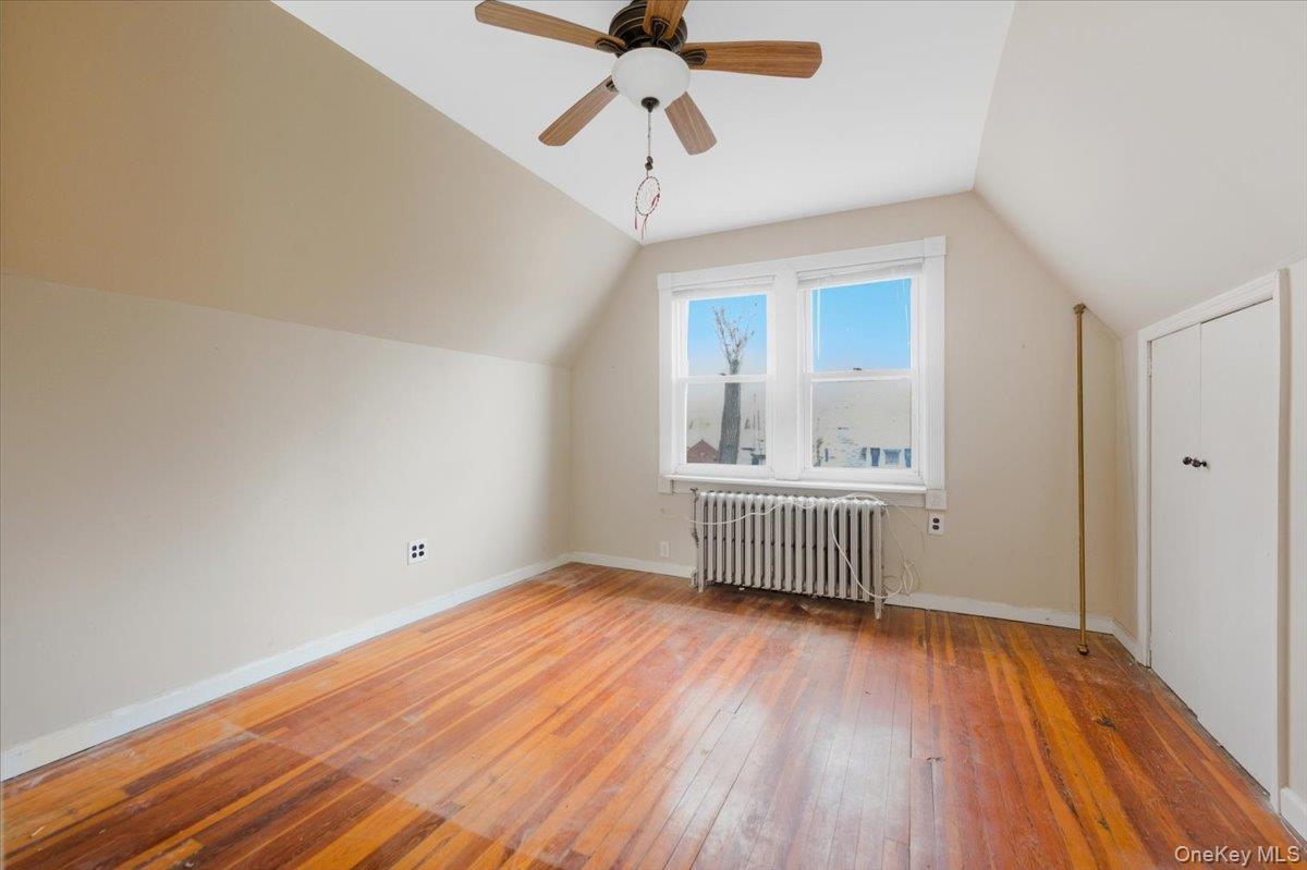 22 Sunset Trail, Unit 22 Bronx, NY 10465 - Photo 10 of 21 a view of room with wooden floor and ceiling fan