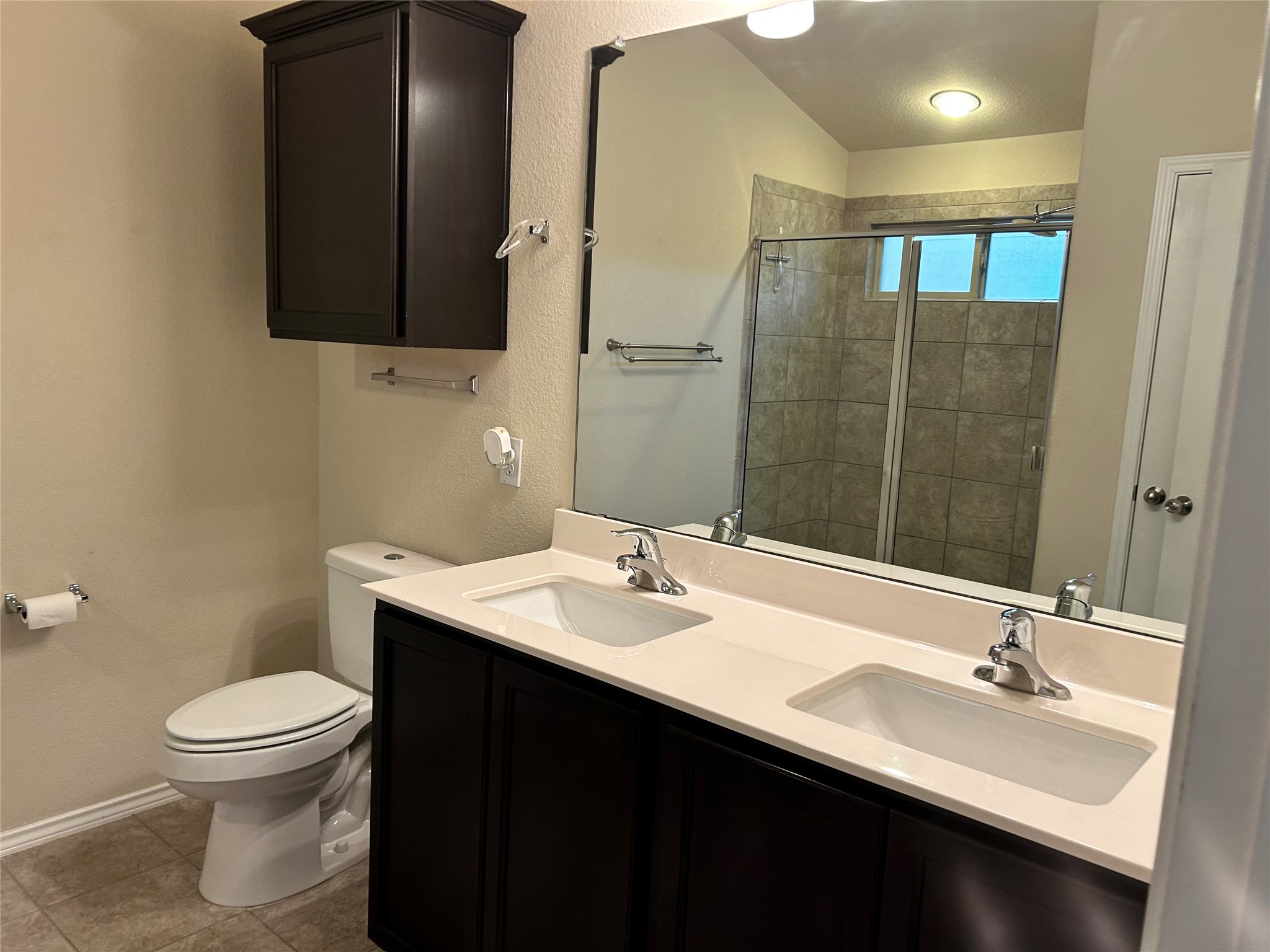 211 Animas Drive Georgetown, TX 78626 - Photo 16 of 25 a bathroom with a sink and a mirror
