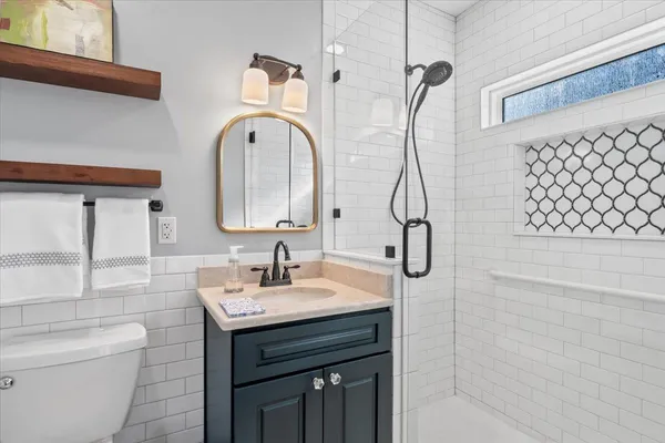 a bathroom with a sink a toilet and bathtub