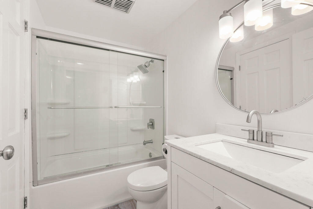 17 Highview Drive, Unit 17 Sandwich, MA 02563 - Photo 13 of 32 a bathroom with a granite countertop sink toilet and shower