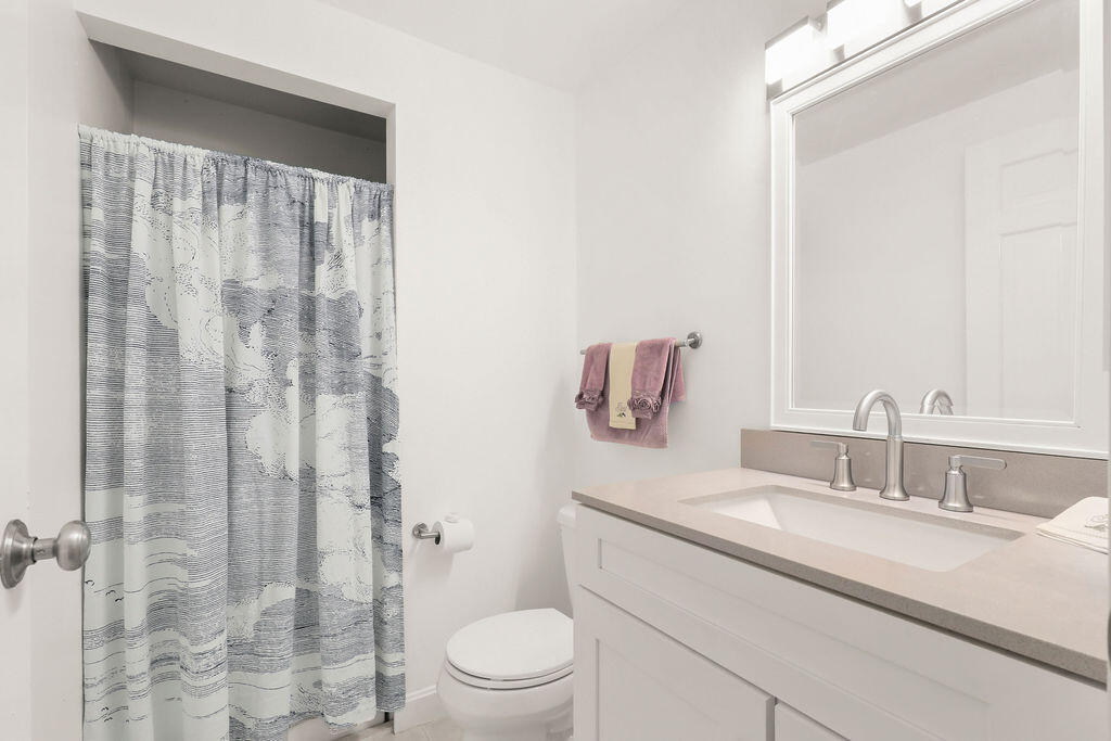 17 Highview Drive, Unit 17 Sandwich, MA 02563 - Photo 15 of 32 a bathroom with a granite countertop sink a toilet and shower