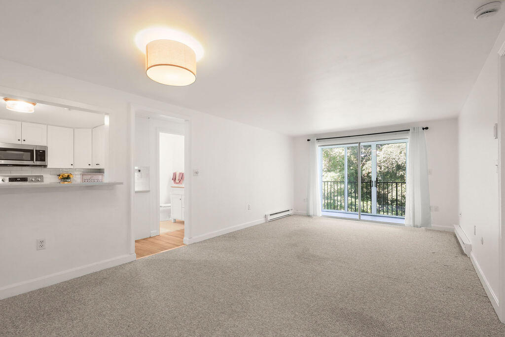 17 Highview Drive, Unit 17 Sandwich, MA 02563 - Photo 4 of 32 a view of an empty room with a window