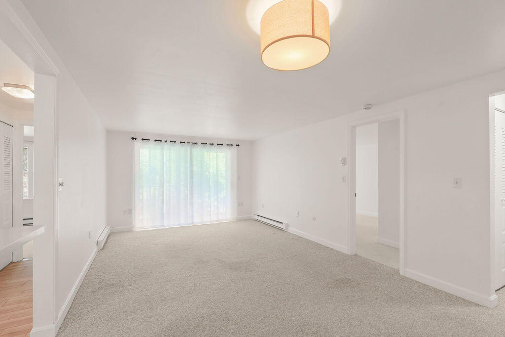 17 Highview Drive, Unit 17 Sandwich, MA 02563 - Photo 5 of 32 a view of an empty room with a window