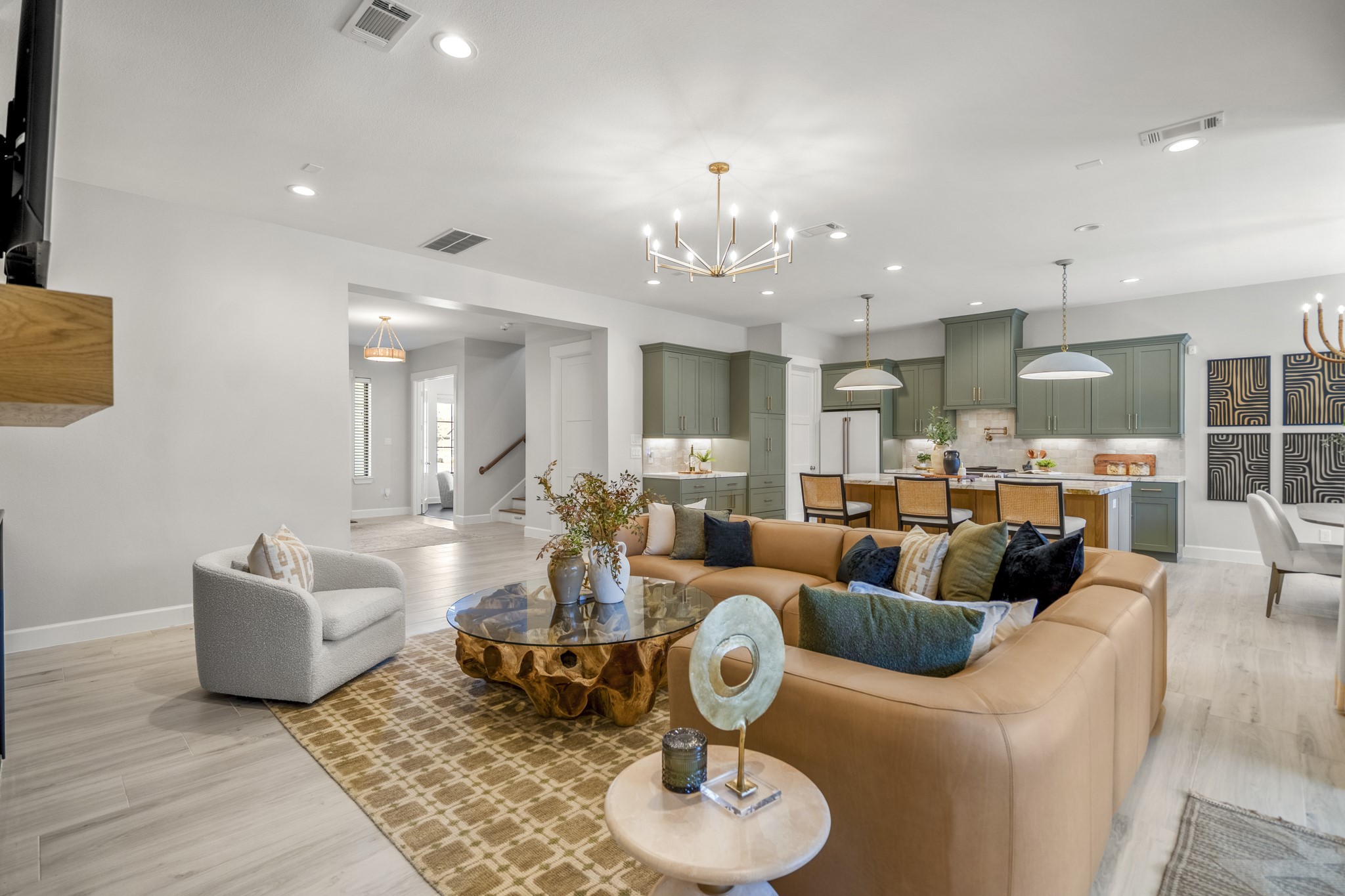 21255 Hidden Bend Loop Magnolia, TX 77354 - Photo 10 of 44 a living room with furniture kitchen view and a chandelier
