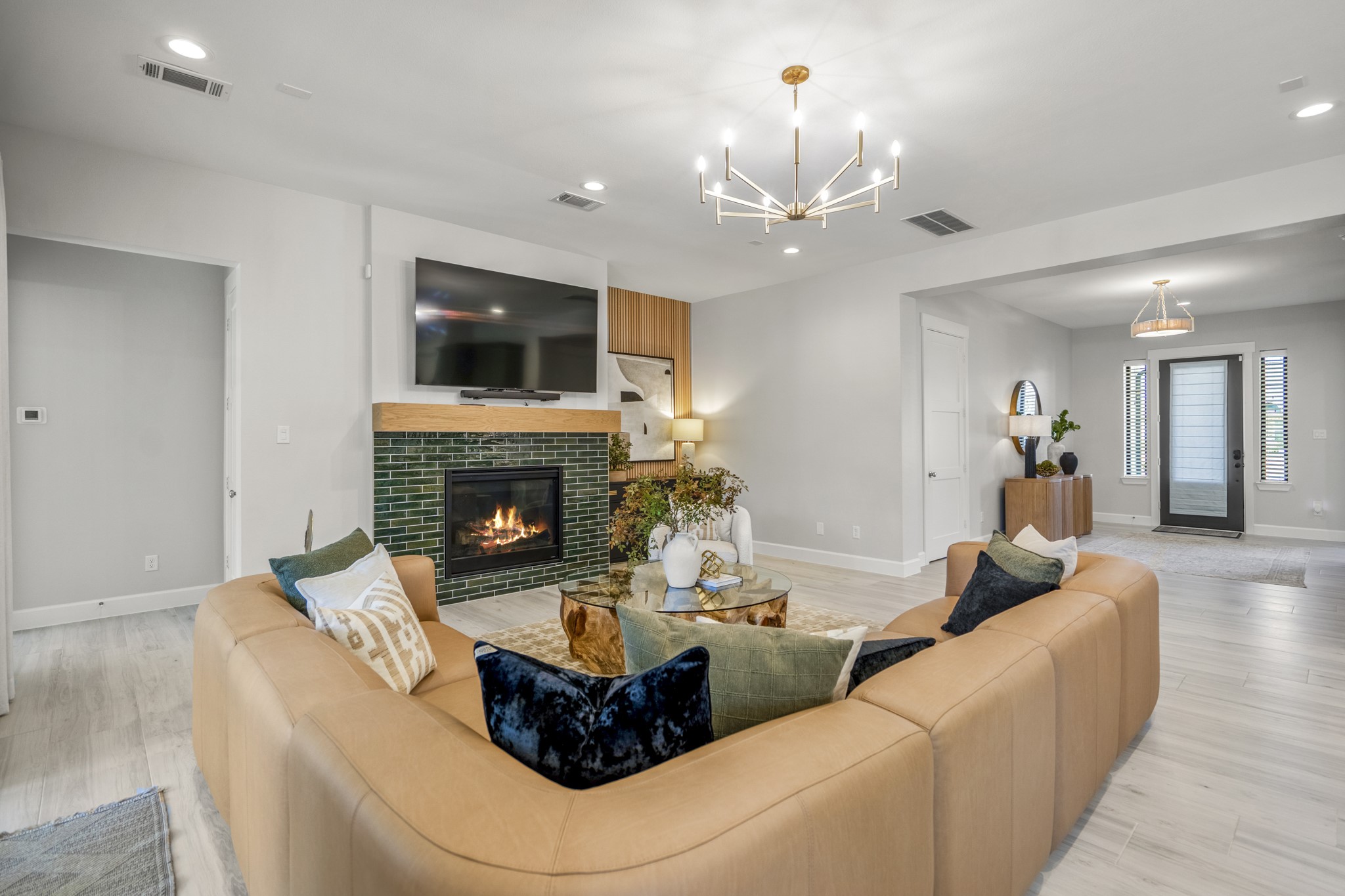 21255 Hidden Bend Loop Magnolia, TX 77354 - Photo 11 of 44 a living room with furniture a flat screen tv and a fireplace