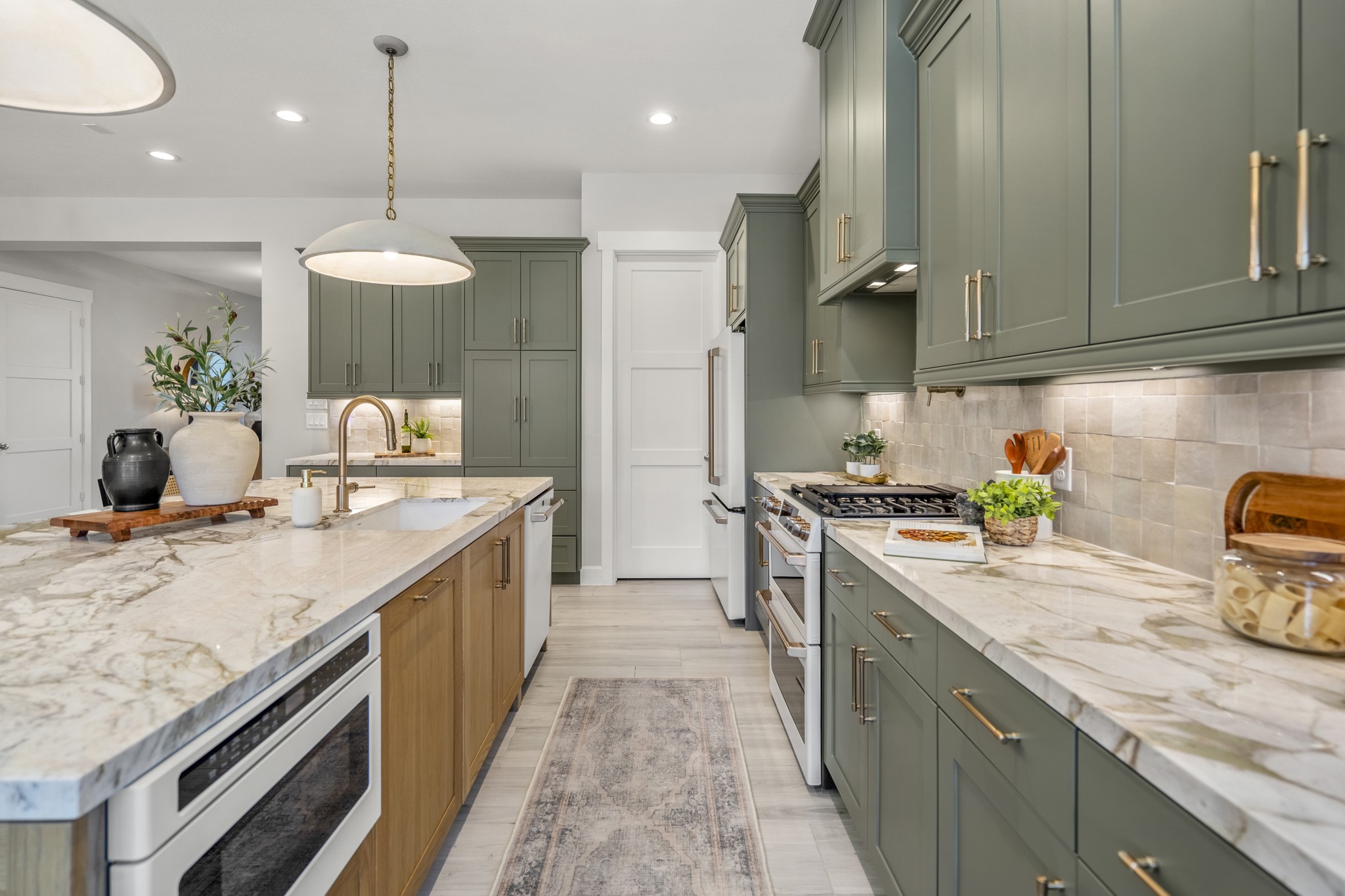21255 Hidden Bend Loop Magnolia, TX 77354 - Photo 16 of 44 a kitchen with a sink stove and cabinets