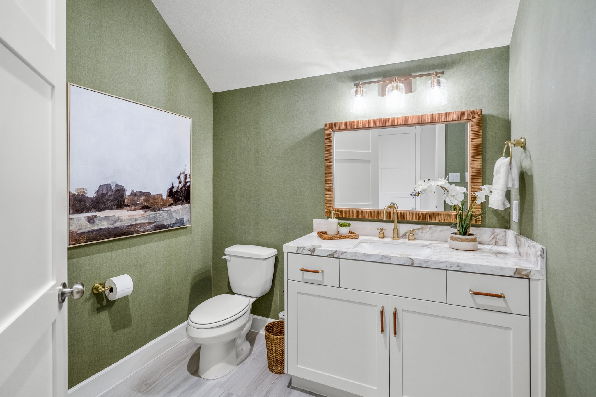 21255 Hidden Bend Loop Magnolia, TX 77354 - Photo 18 of 44 a bathroom with a toilet sink vanity and mirror