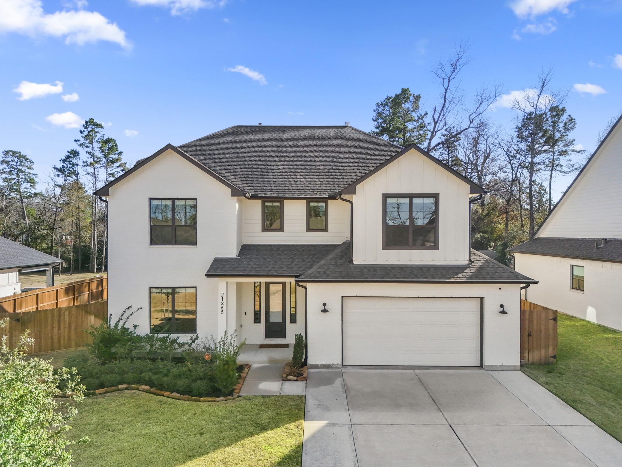21255 Hidden Bend Loop Magnolia, TX 77354 - Photo 2 of 44 a view of a house with a yard and potted plants