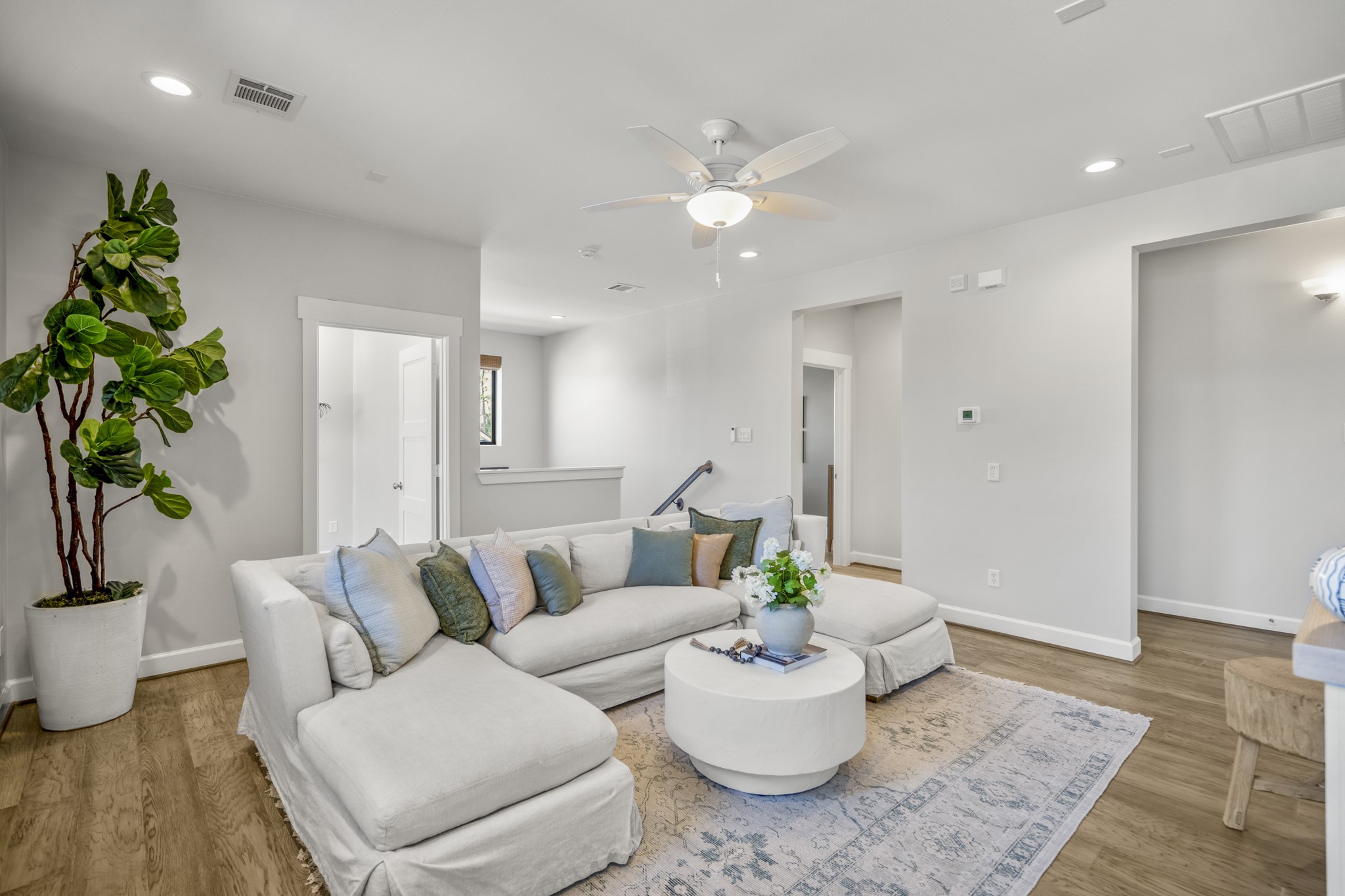 21255 Hidden Bend Loop Magnolia, TX 77354 - Photo 26 of 44 a living room with furniture and a potted plant