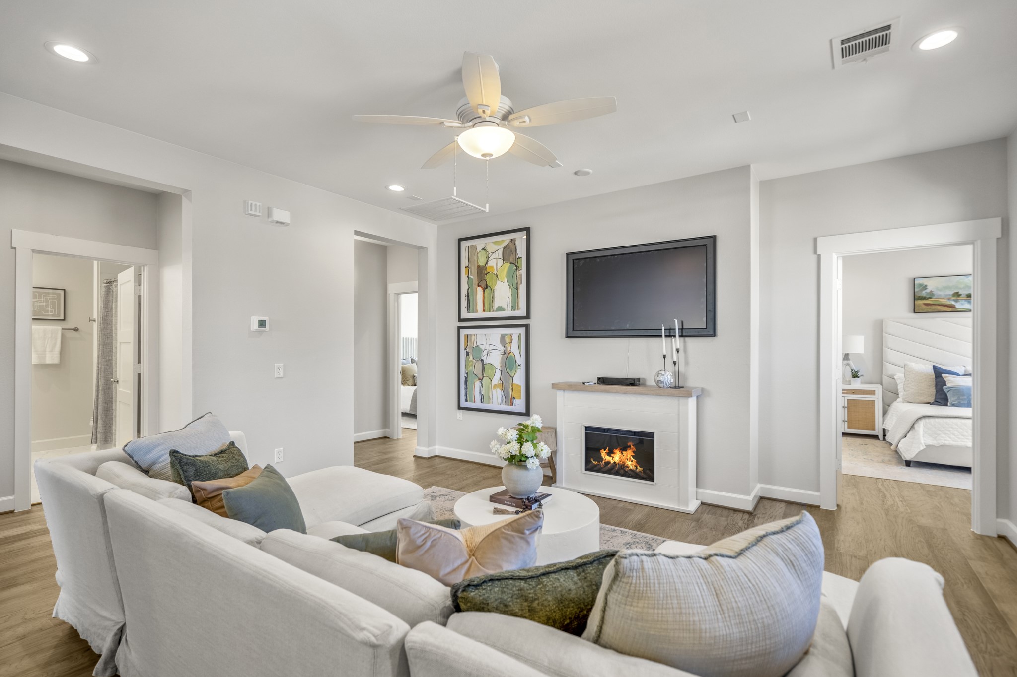 21255 Hidden Bend Loop Magnolia, TX 77354 - Photo 27 of 44 a living room with furniture flat screen tv and a fireplace