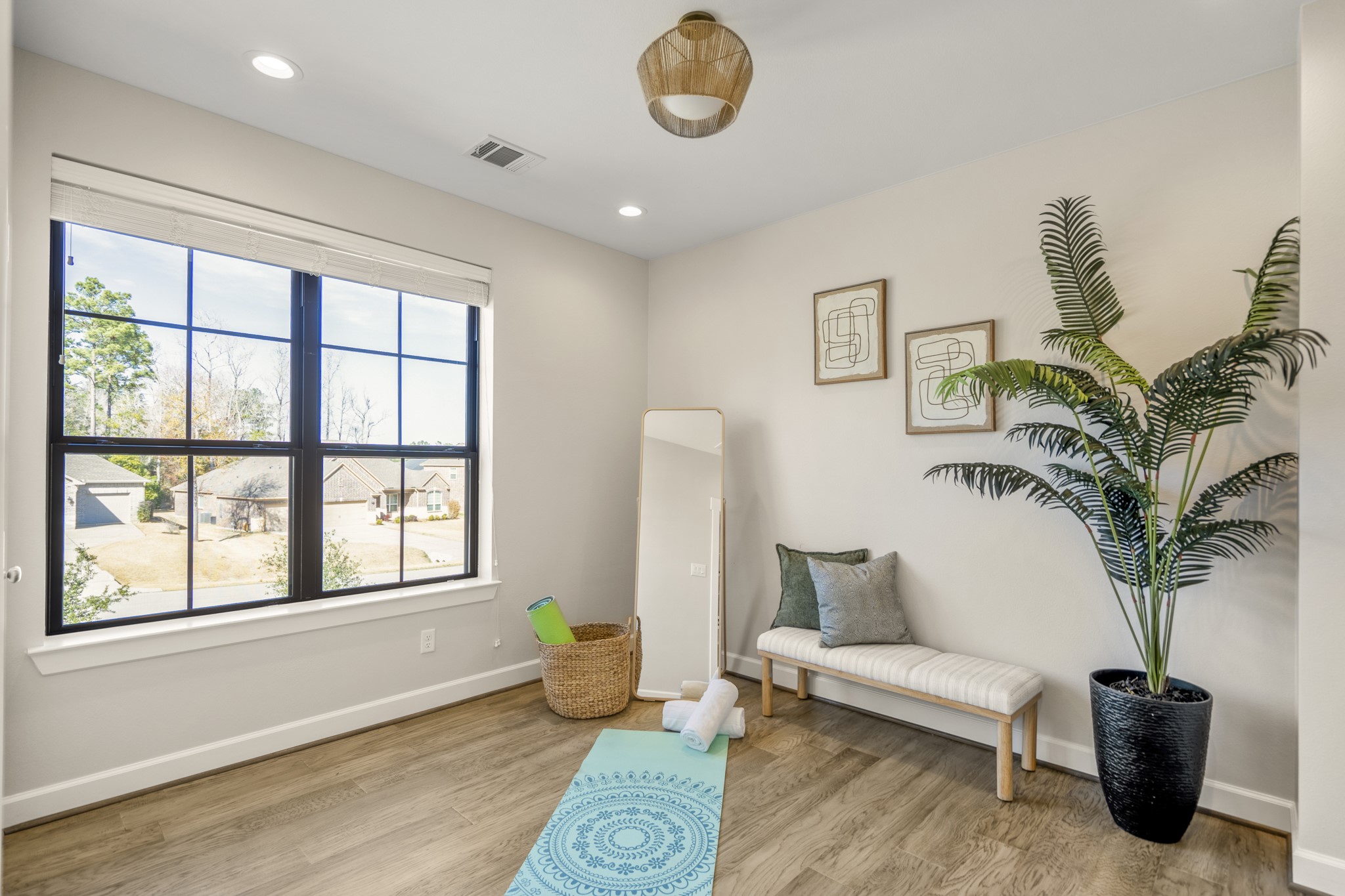 21255 Hidden Bend Loop Magnolia, TX 77354 - Photo 28 of 44 a living room with furniture potted plant and a window