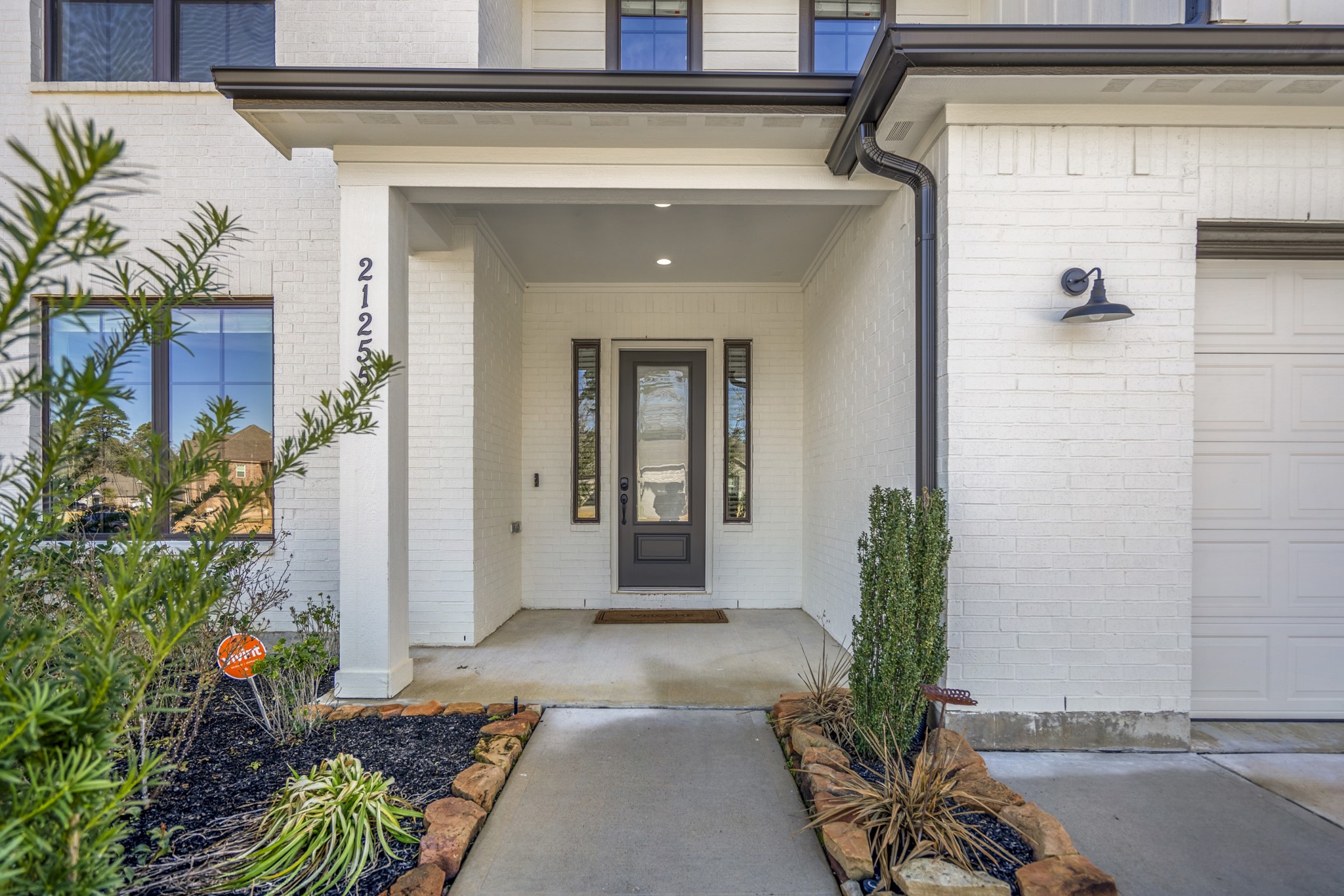 21255 Hidden Bend Loop Magnolia, TX 77354 - Photo 3 of 44 a view of a entryway door of the house