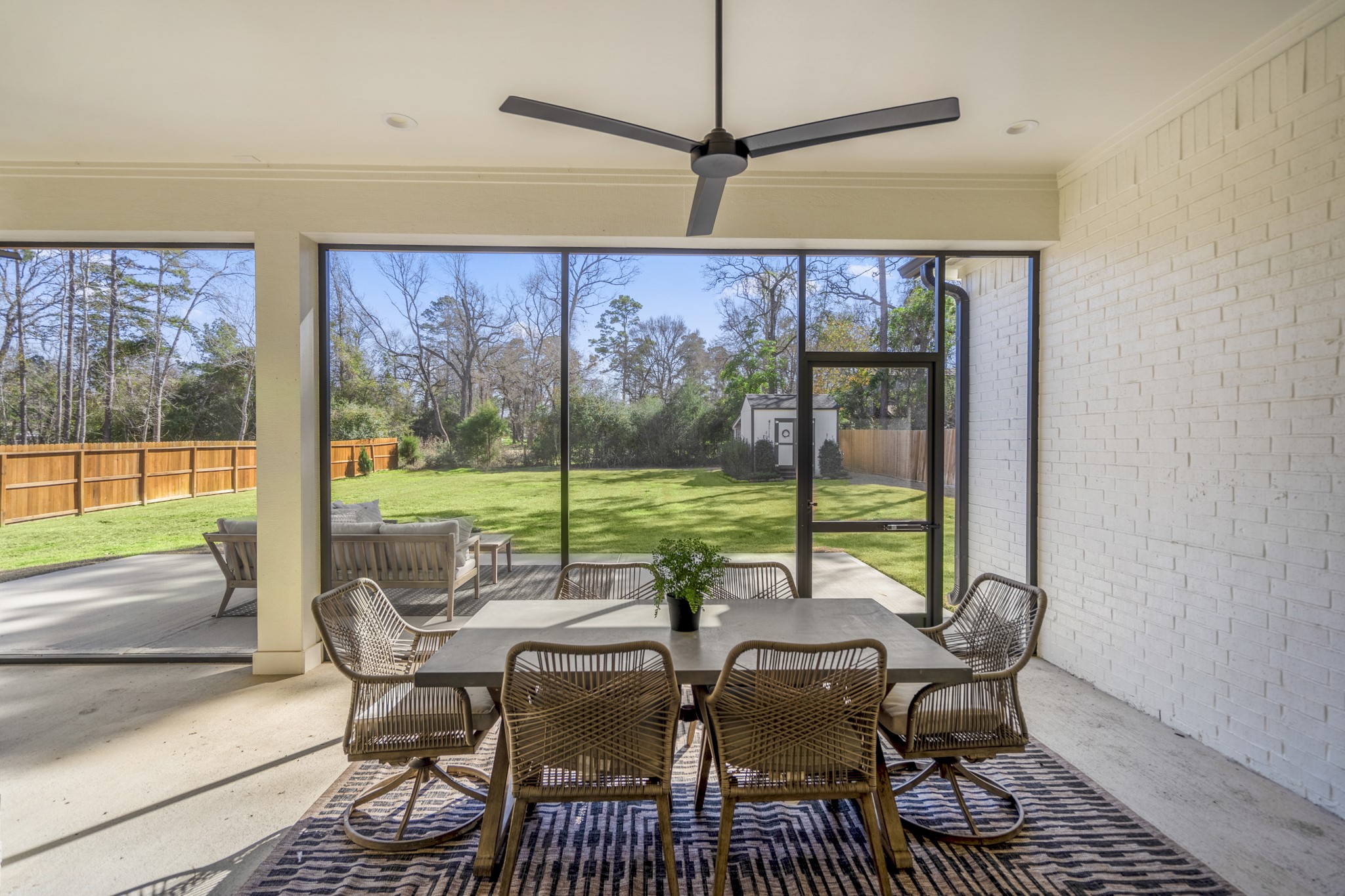 21255 Hidden Bend Loop Magnolia, TX 77354 - Photo 34 of 44 a view of a dining room with furniture large windows and wooden floor