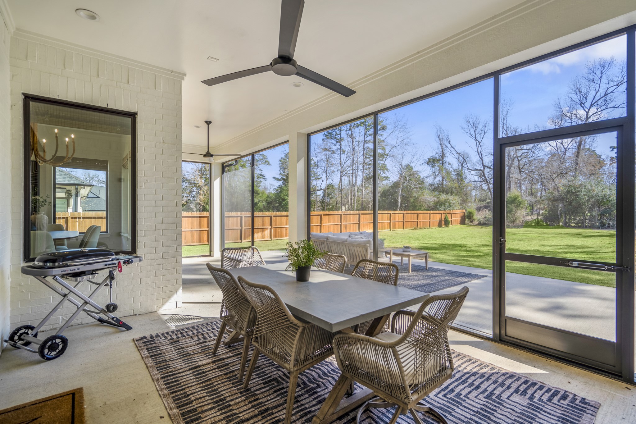 21255 Hidden Bend Loop Magnolia, TX 77354 - Photo 35 of 44 a view of a dining room with furniture wooden floor and outside view