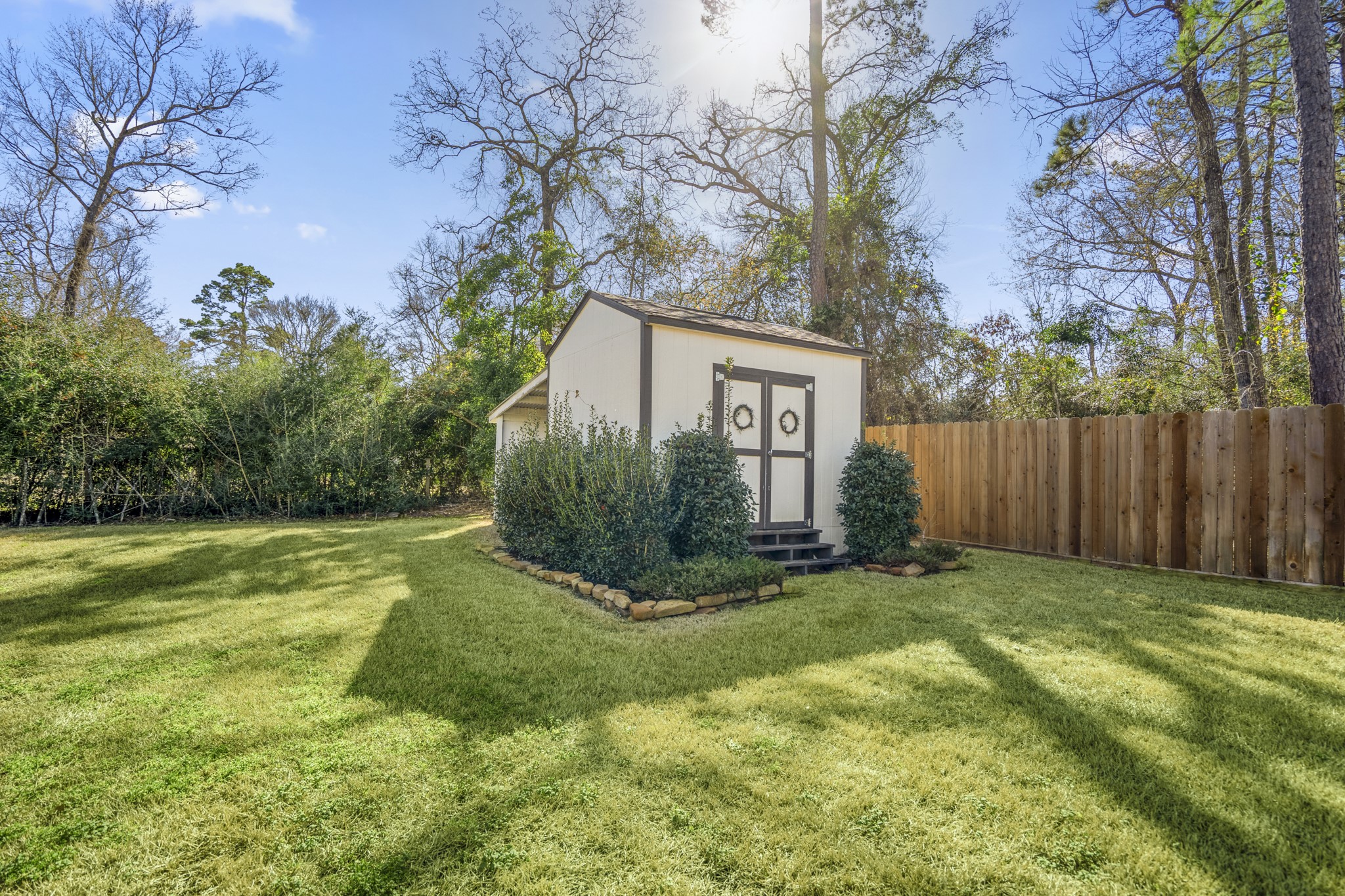 21255 Hidden Bend Loop Magnolia, TX 77354 - Photo 38 of 44 a view of a backyard with large trees