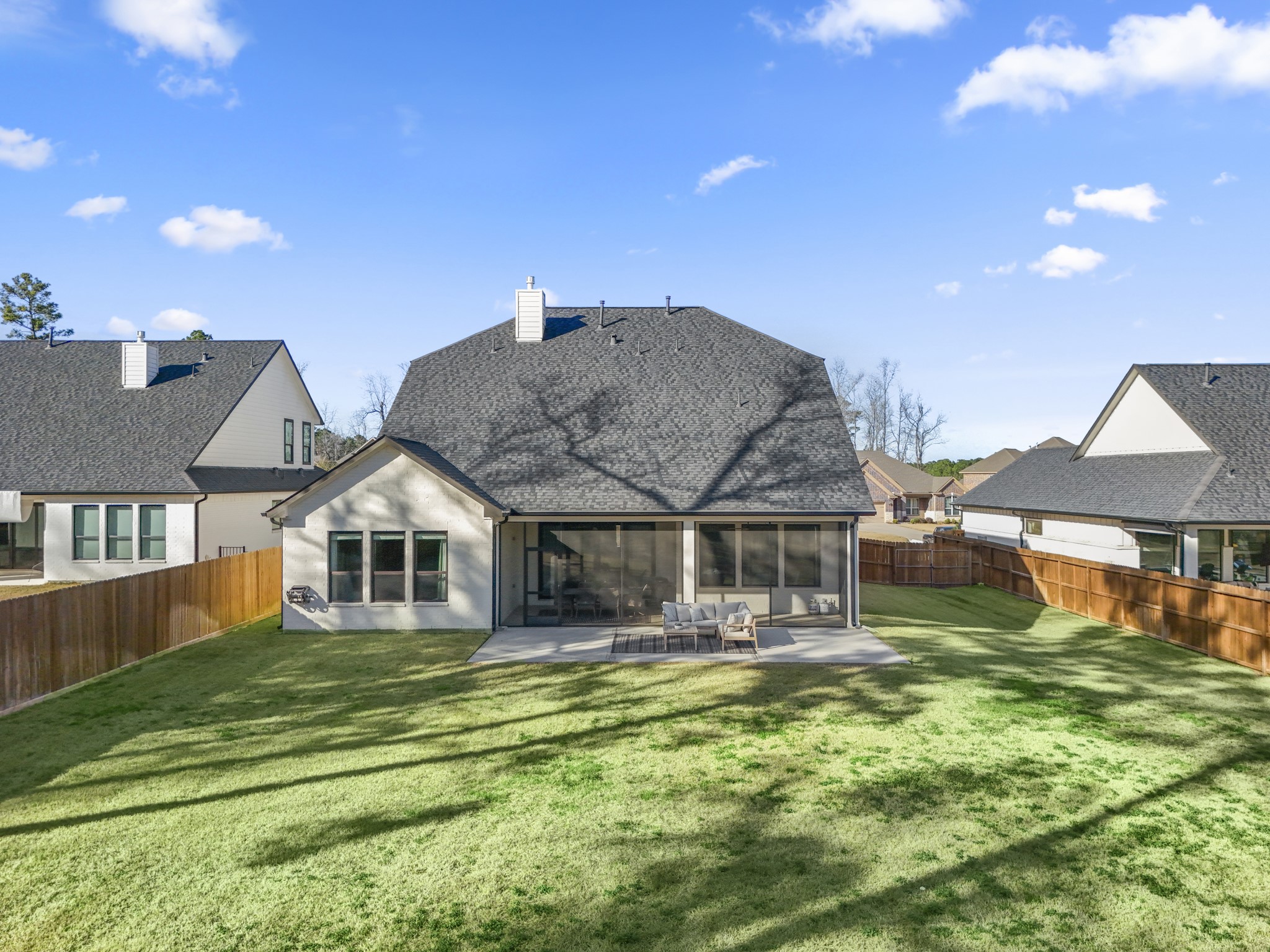 21255 Hidden Bend Loop Magnolia, TX 77354 - Photo 42 of 44 a front view of a house with a yard table and chairs
