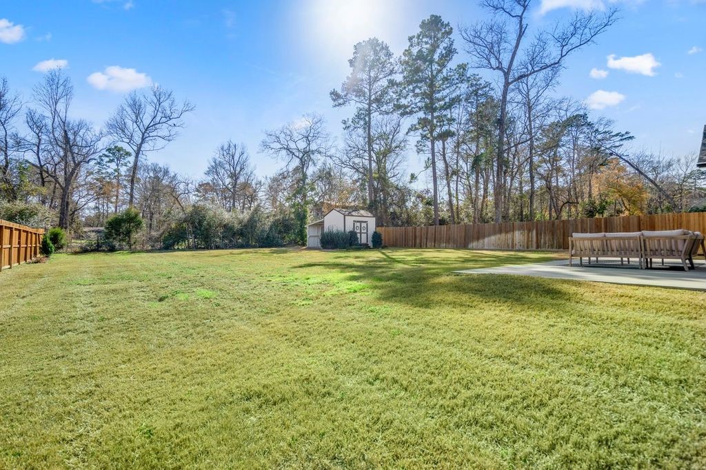 21255 Hidden Bend Loop Magnolia, TX 77354 - Photo 43 of 44 a garden view with a fountain