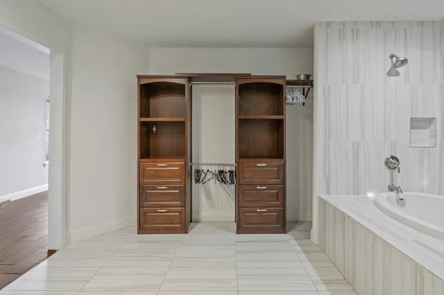 a bathroom with a bathtub and a sink