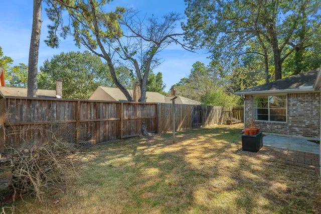 a view of a backyard with a trees