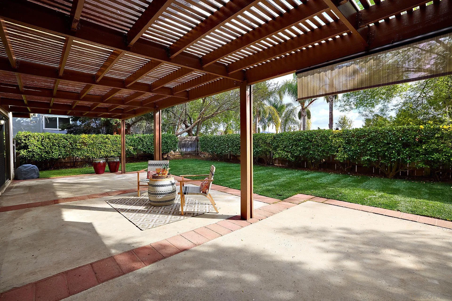 13269 Vinter Way Poway, CA 92064 - Photo 12 of 32 a view of a patio with a table chairs and a backyard