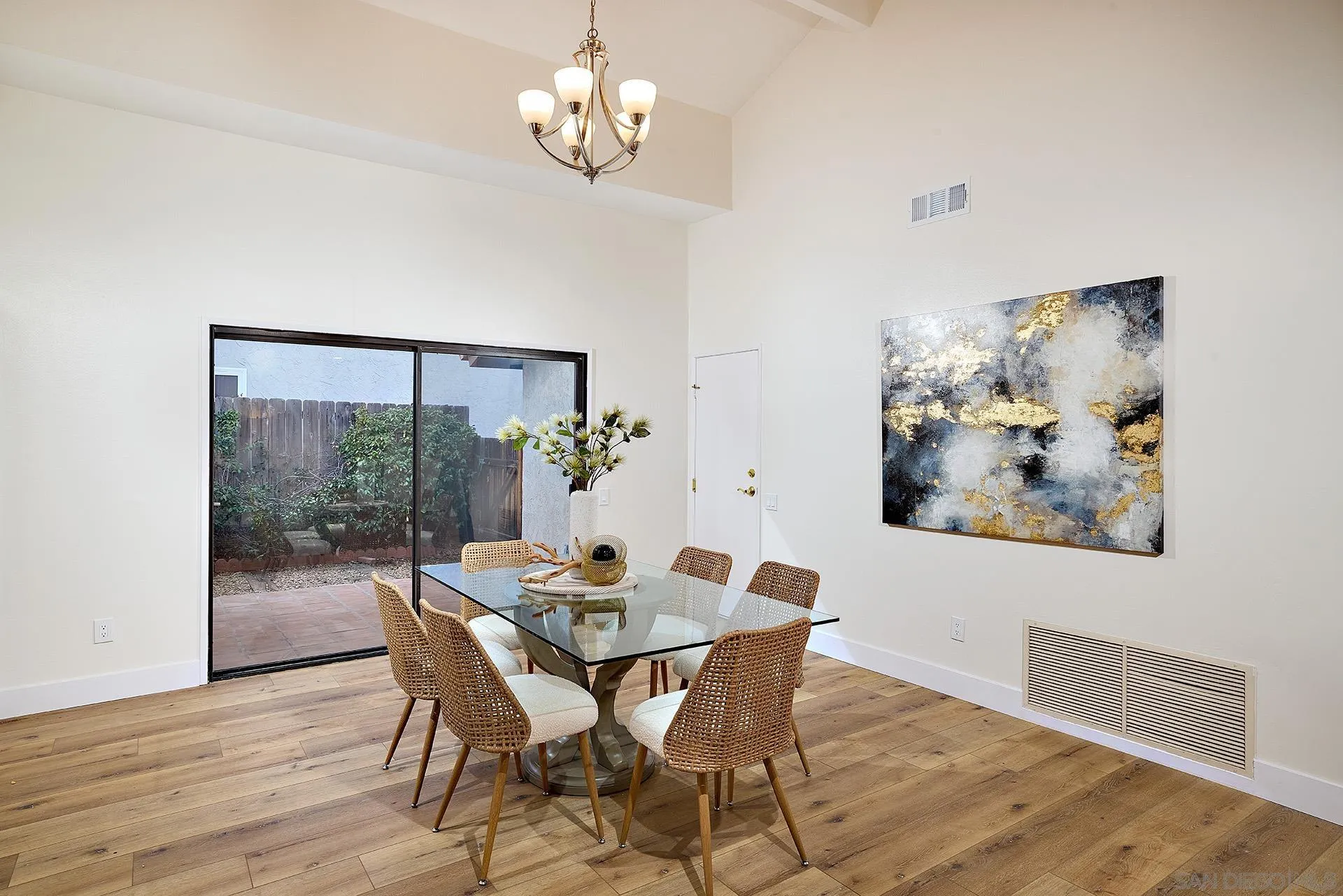 13269 Vinter Way Poway, CA 92064 - Photo 15 of 32 a view of a dining room with furniture wooden floor and a chandelier