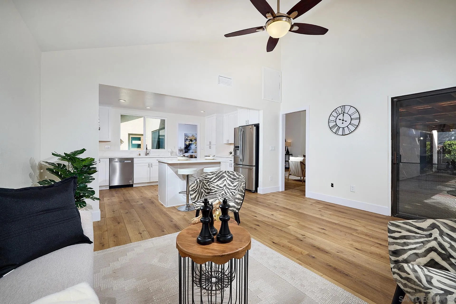 13269 Vinter Way Poway, CA 92064 - Photo 17 of 32 a living room with furniture and a chandelier