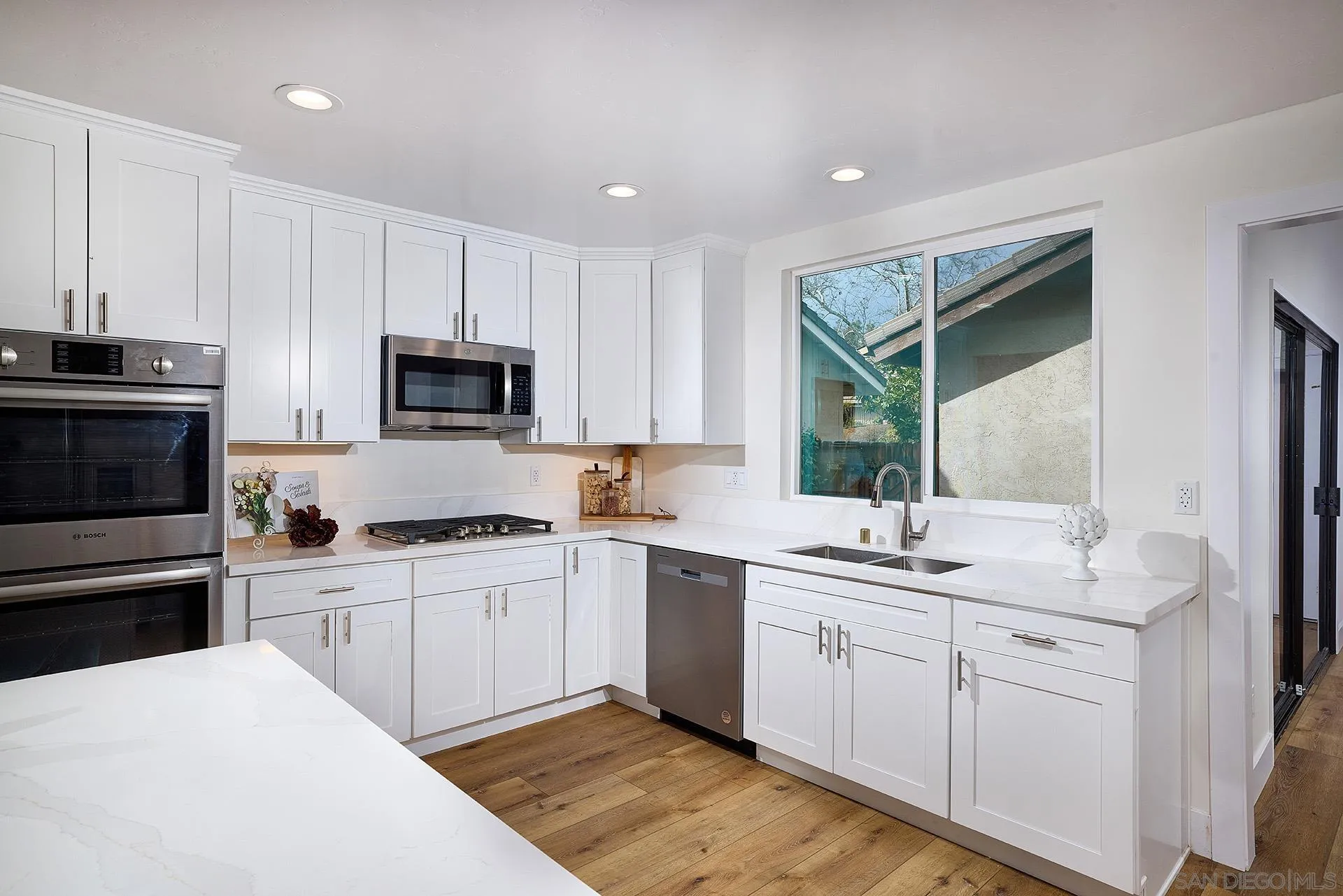 13269 Vinter Way Poway, CA 92064 - Photo 21 of 32 a kitchen with a sink stove and microwave