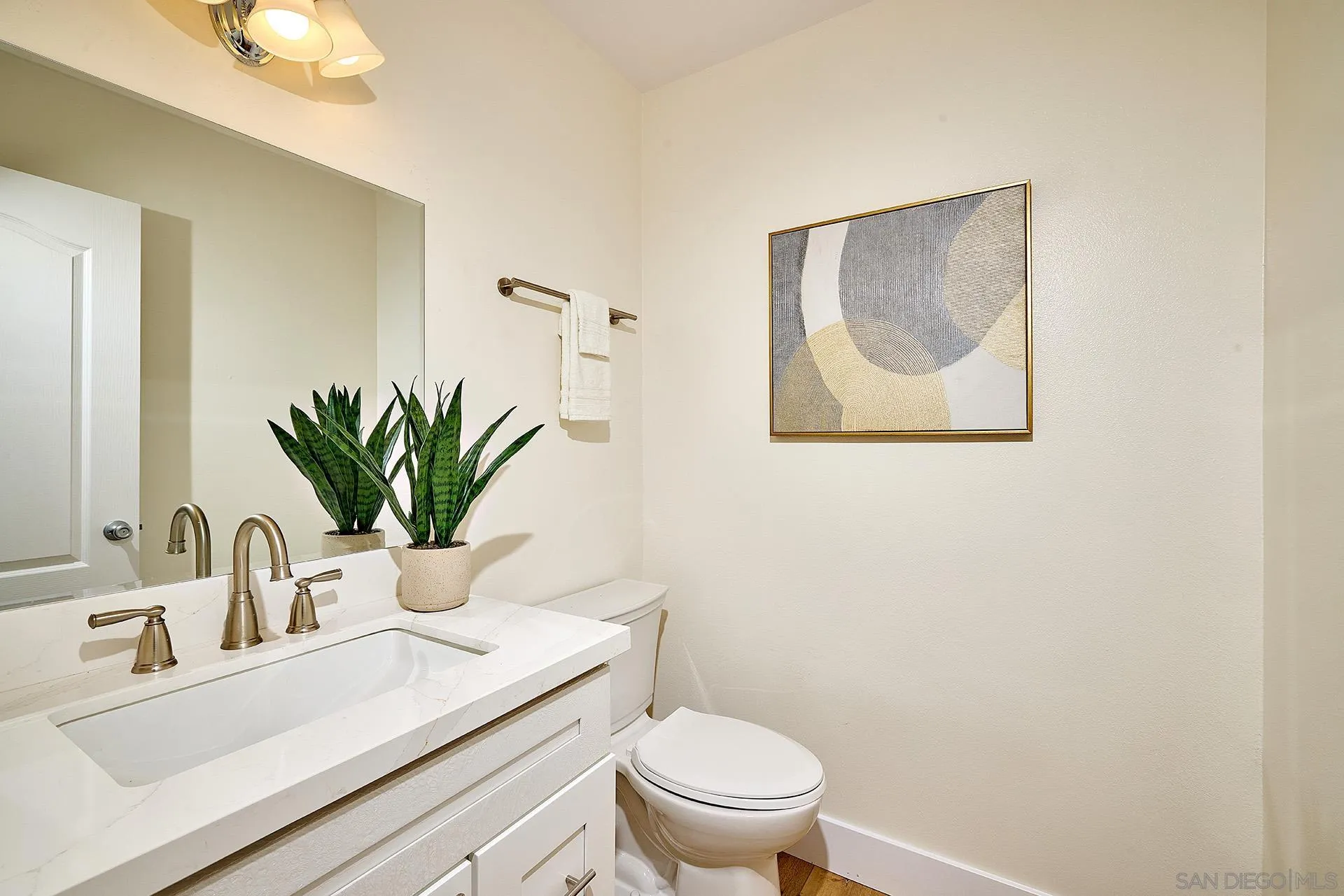 13269 Vinter Way Poway, CA 92064 - Photo 23 of 32 a bathroom with a toilet a sink and mirror