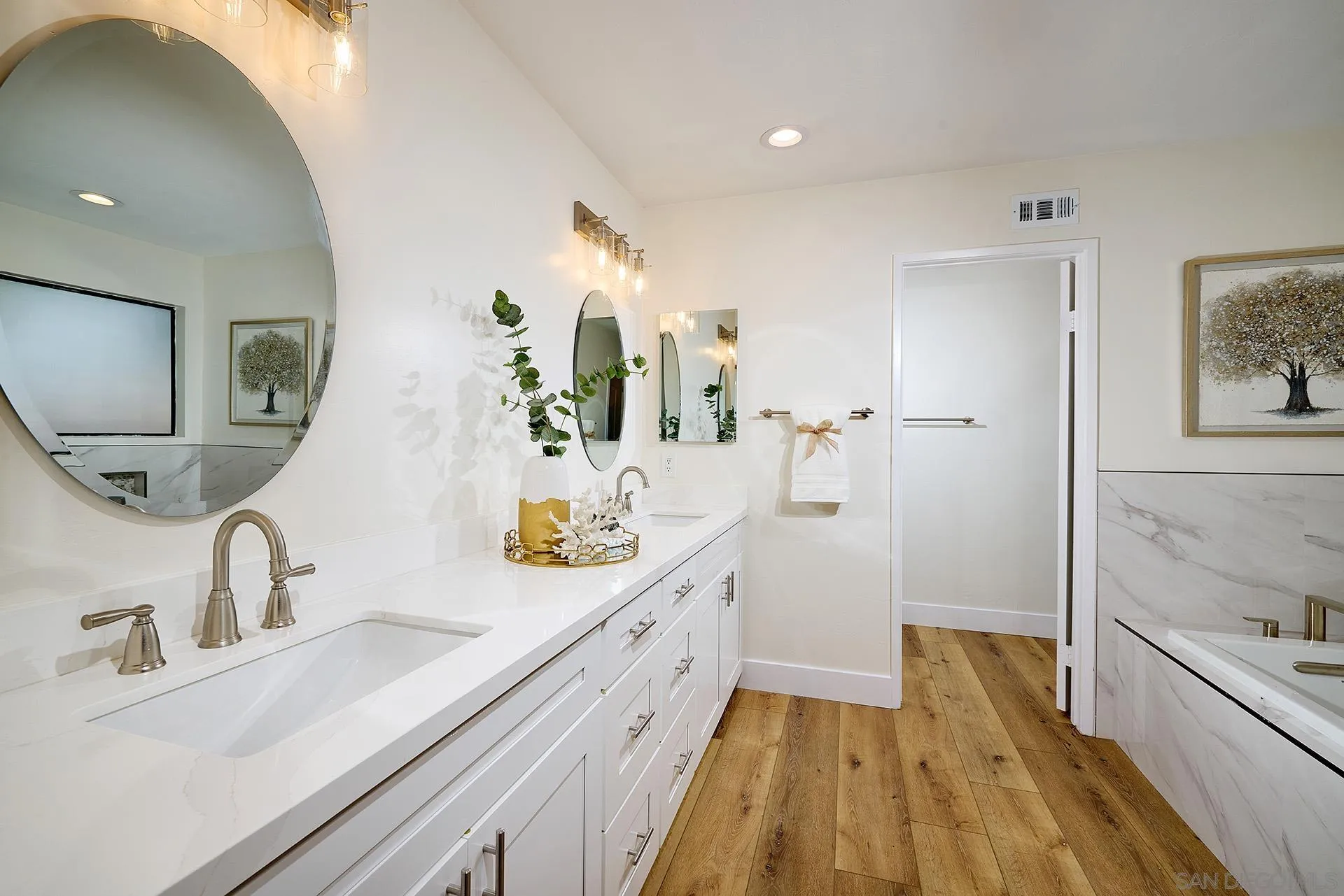 13269 Vinter Way Poway, CA 92064 - Photo 25 of 32 a spacious bathroom with a sink and a large mirror